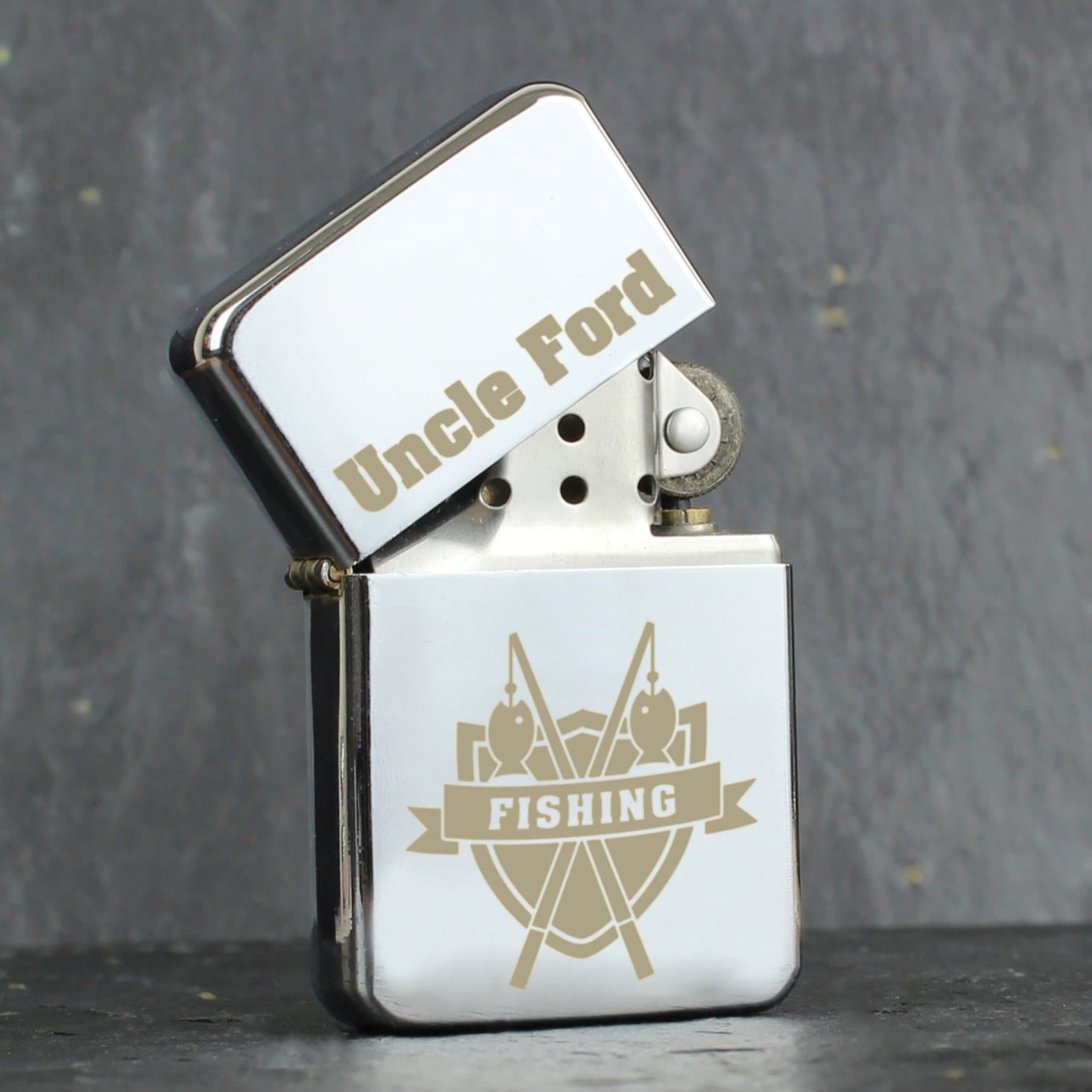 Personalised fishing crest oil lighter with a name at the top