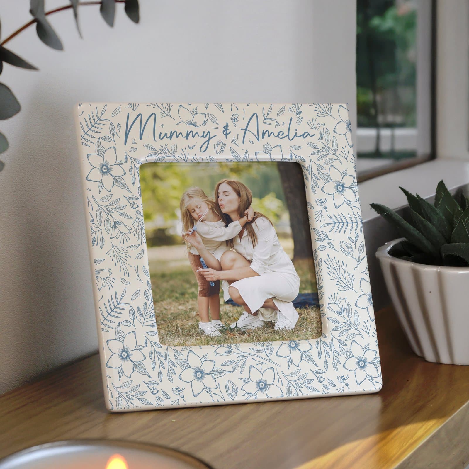 Ceramic square photo frame with a floral design and a personalised line of text