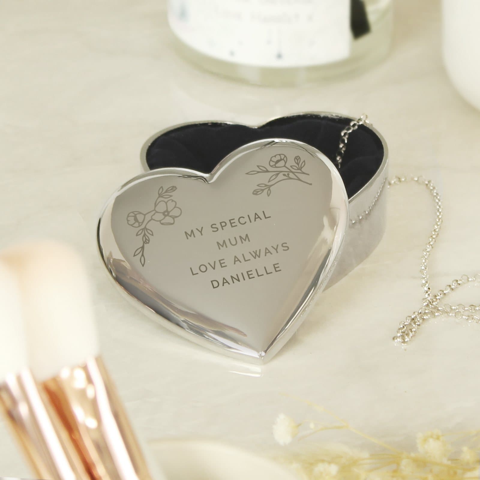 Small nickel plated heart trinket box with a floral design