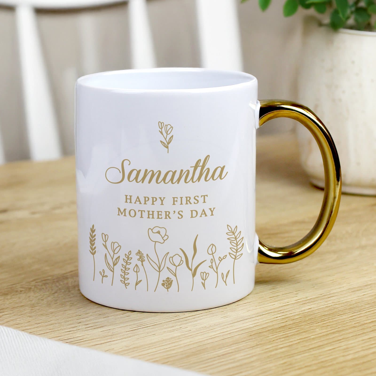 Floral ceramic mug with a gold handle and three lines of personalised text