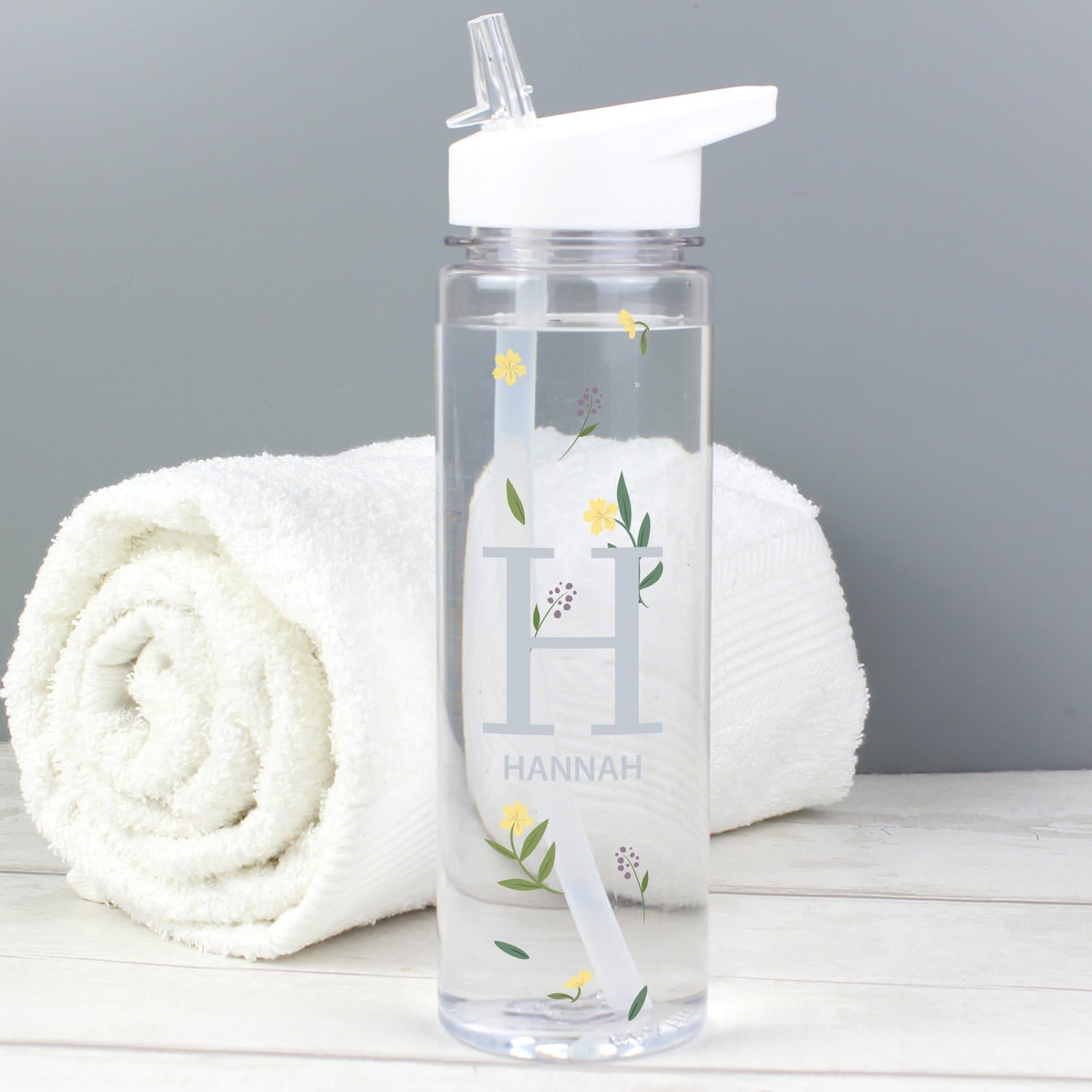 Personalised floral initial water bottle with white twist-on lid and straw spout