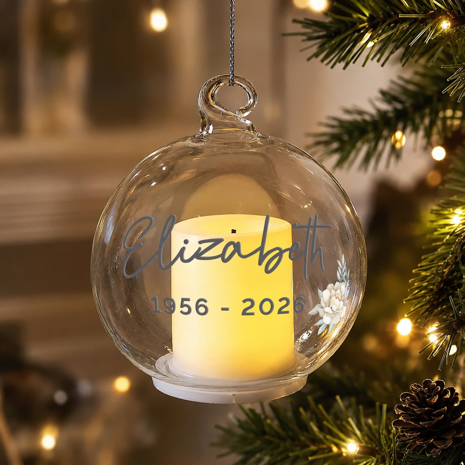 Personalised floral memorial glass bauble with a flickering LED candle inside