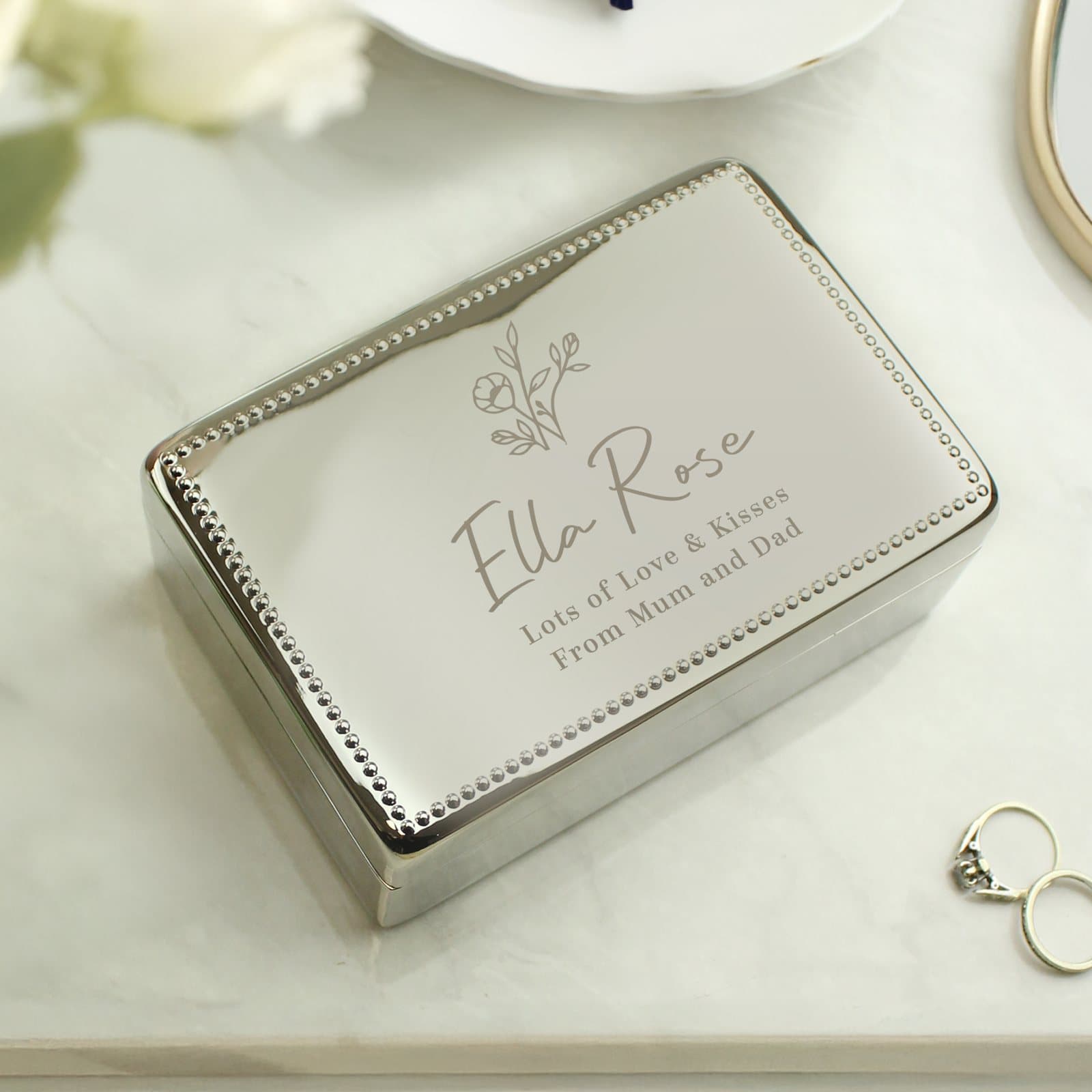 Small nickel plated jewellery box with a floral design