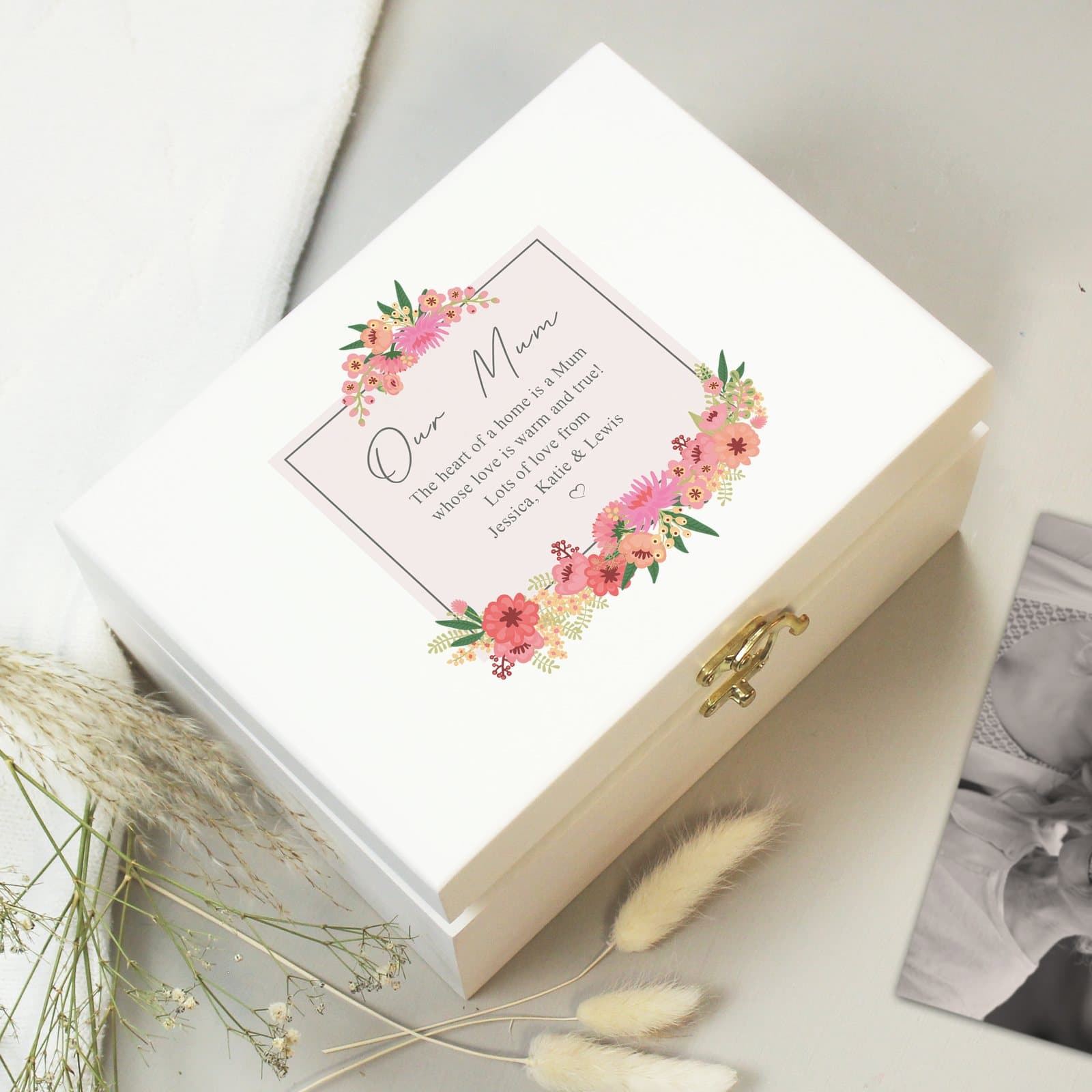 White wooden keepsake box with a floral design, a poem on the lid and personalised text