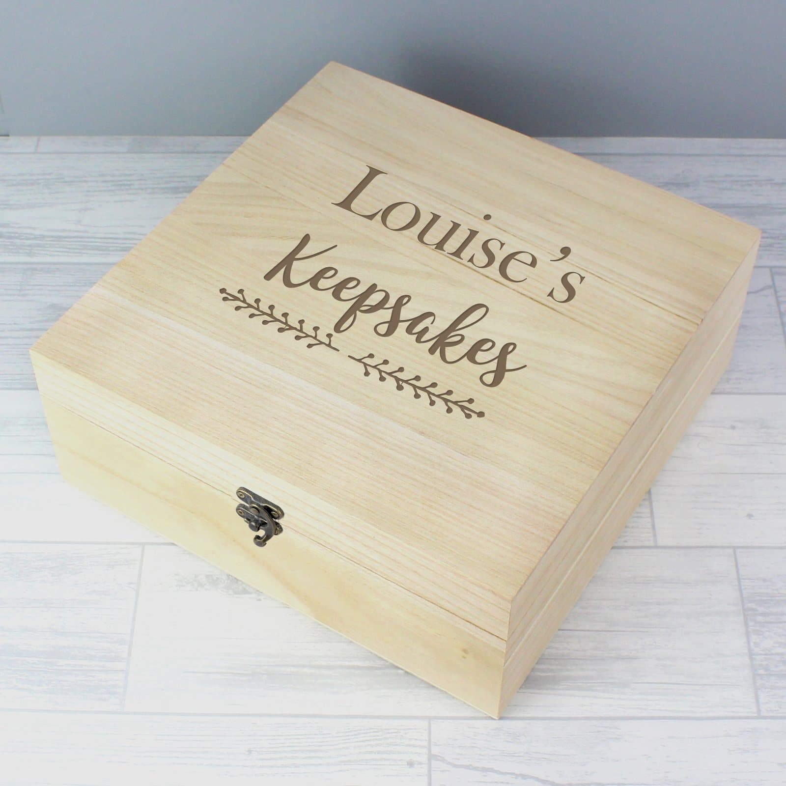 Floral wooden keepsake box with a metal clasp and personalised text on the lid