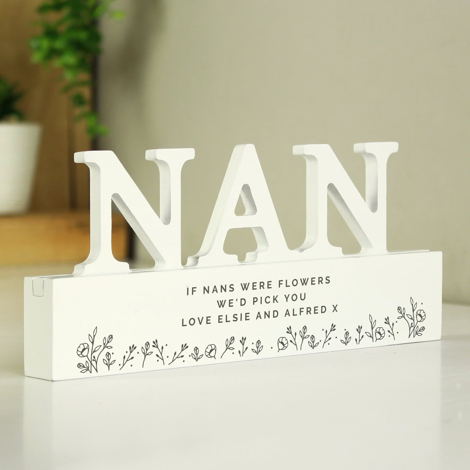 Floral wooden nan ornament with a personalised three-line message