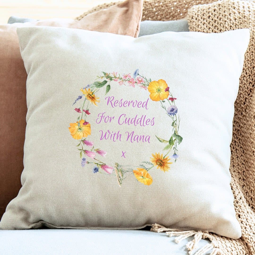 Cream personalised cushion with a flower circle of yellow, pink and purple flowers