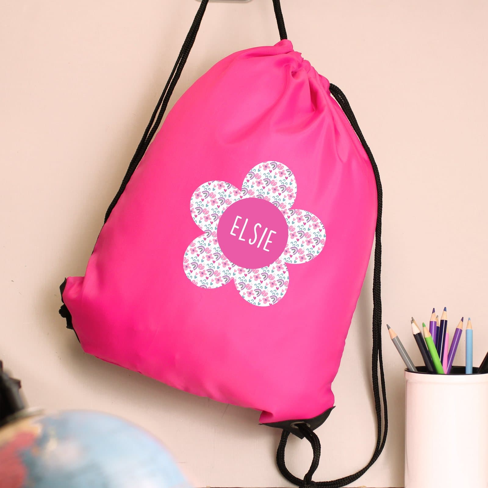 Pink flower drawstring kit bag that doubles as a shoulder bag