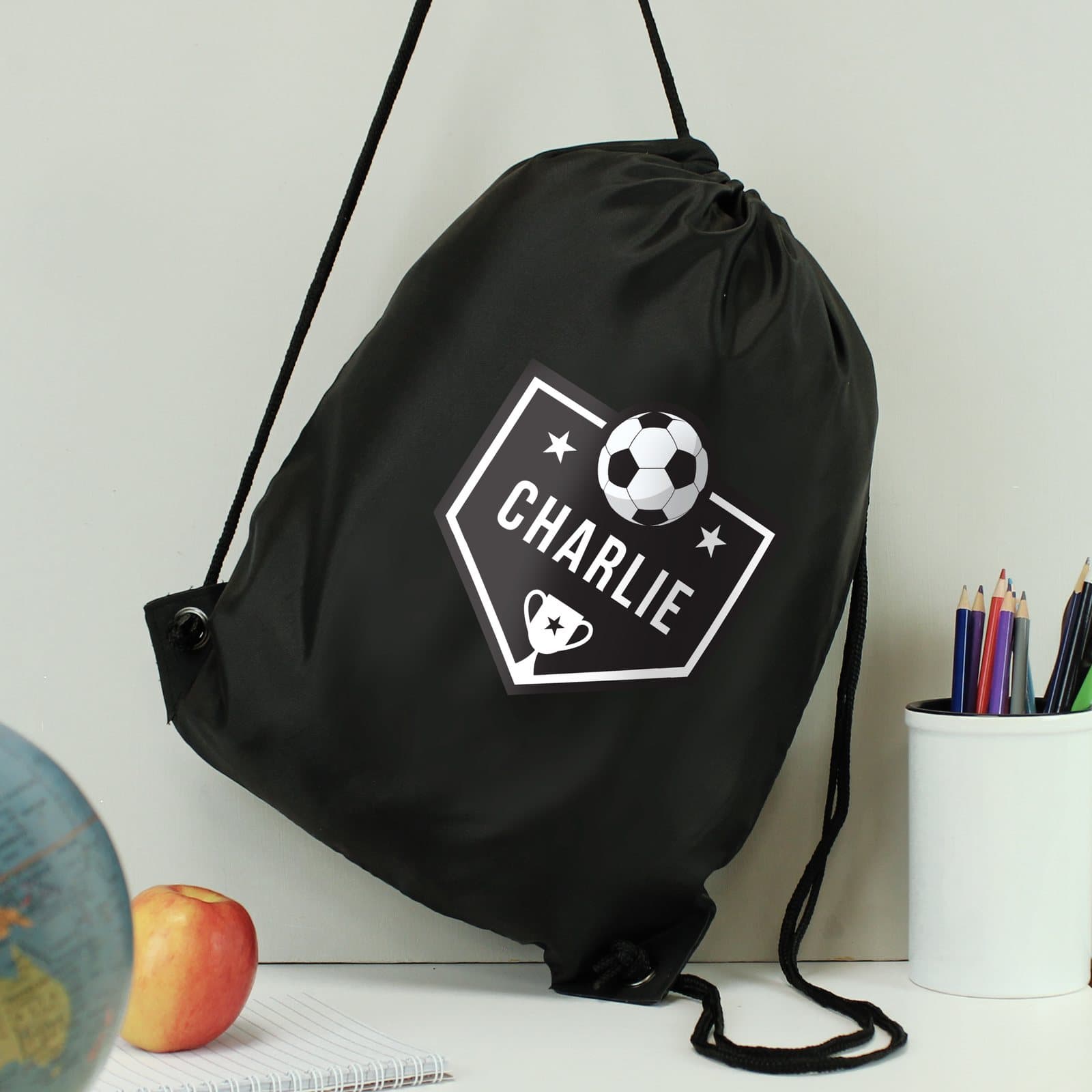 Black football drawstring kit bag with shoulder straps