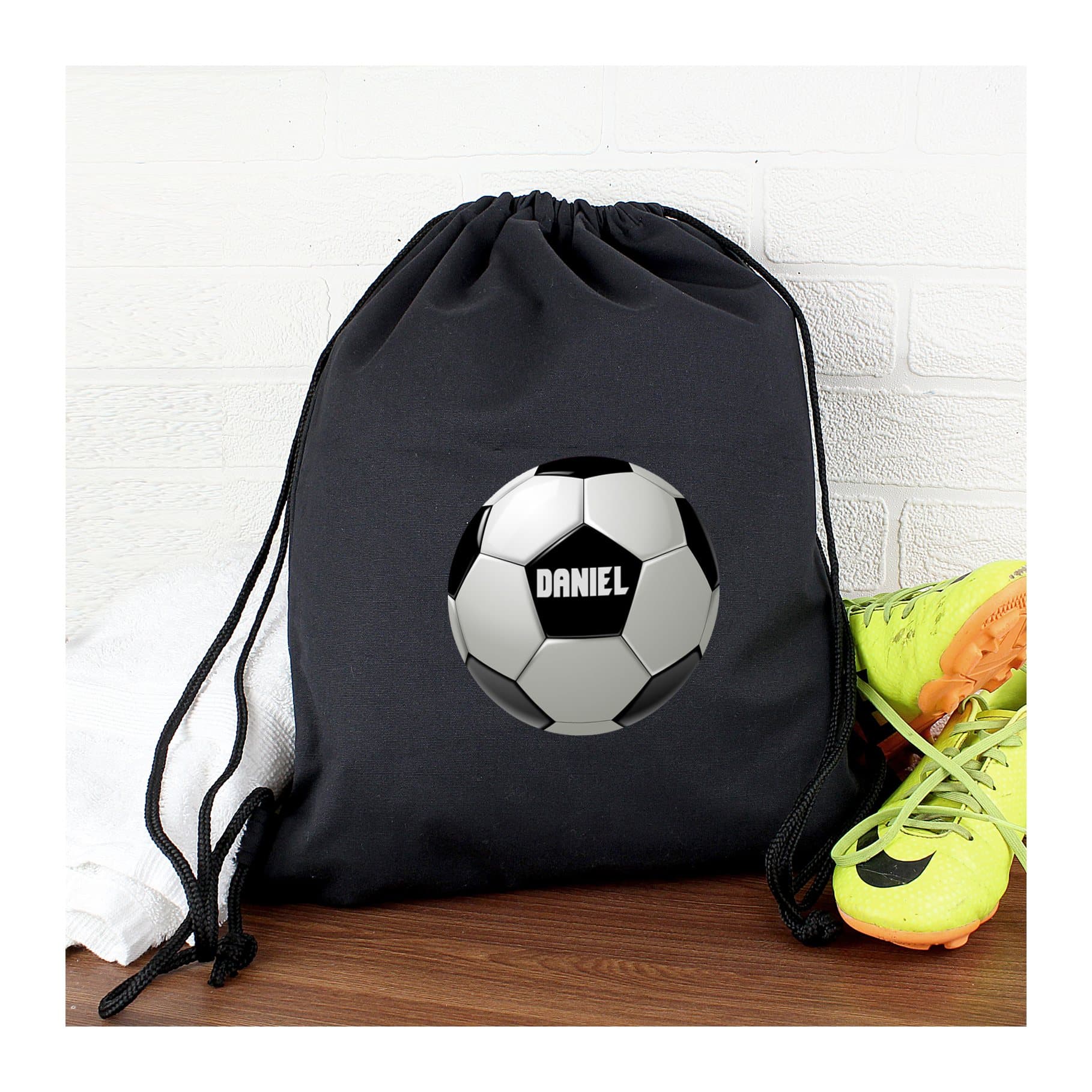 Black drawstring kit bag with a football design