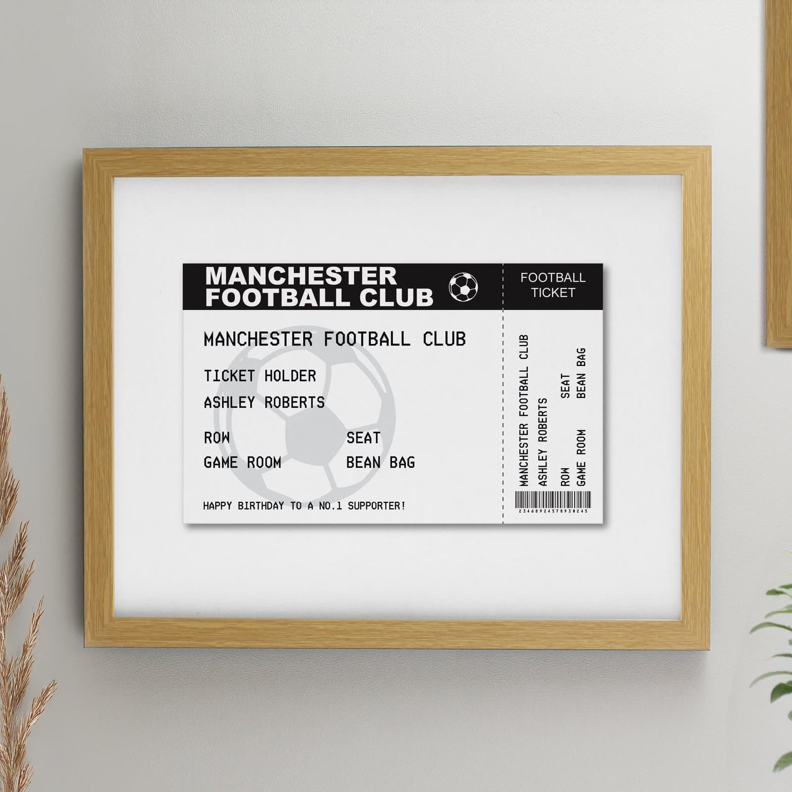 Personalised football ticket print mounted in a large oak frame