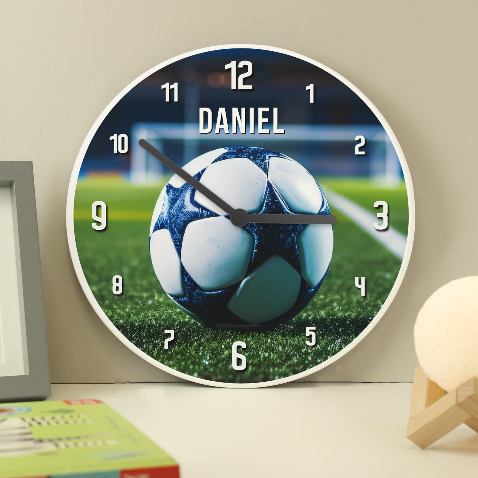 Personalised football wooden children's clock with a pitch themed design