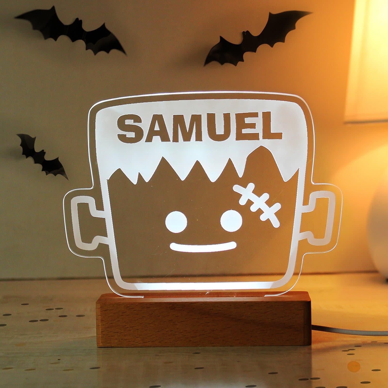 Wooden Frankenstein LED light sign on a base with a name