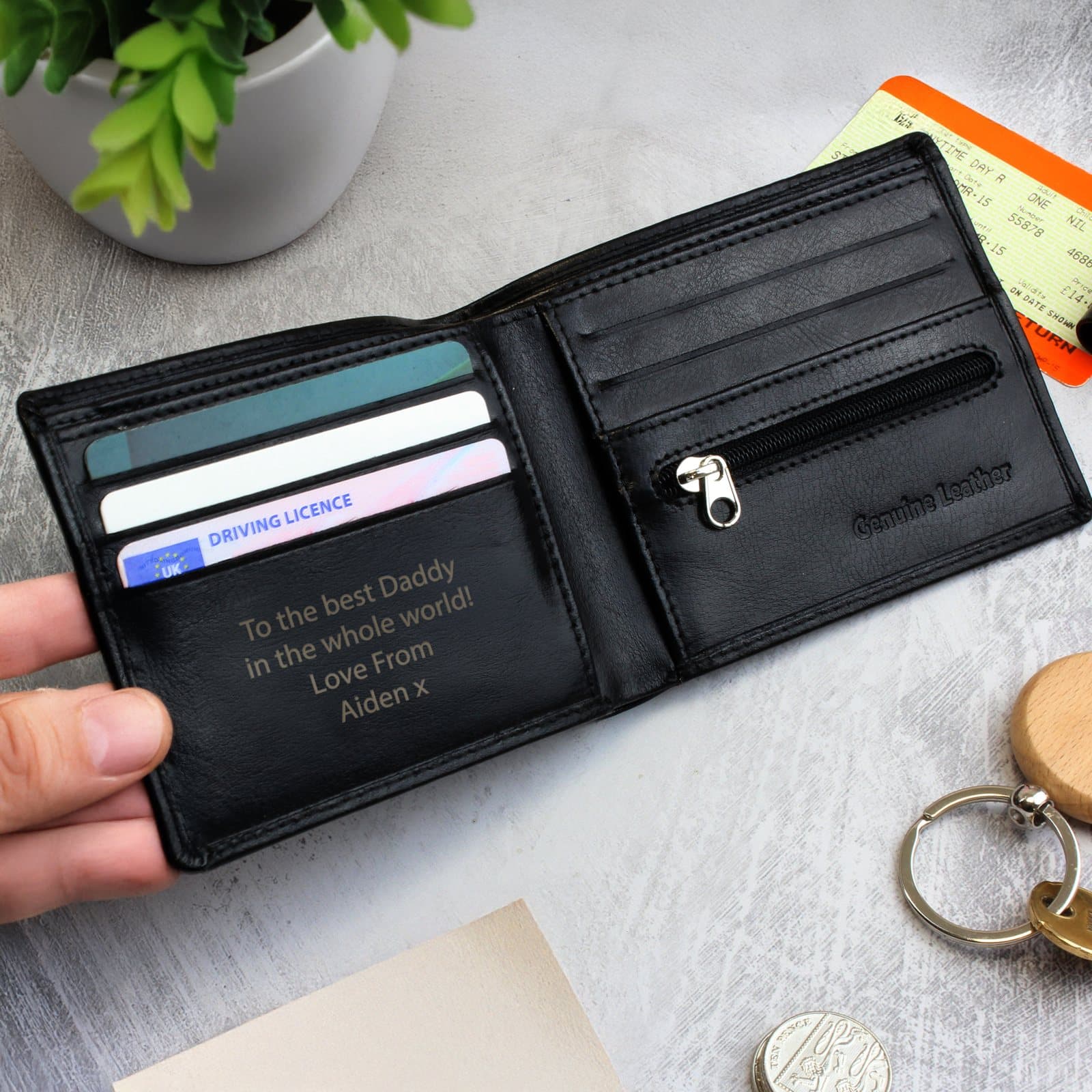 Black leather wallet that can be personalised with a four-line message