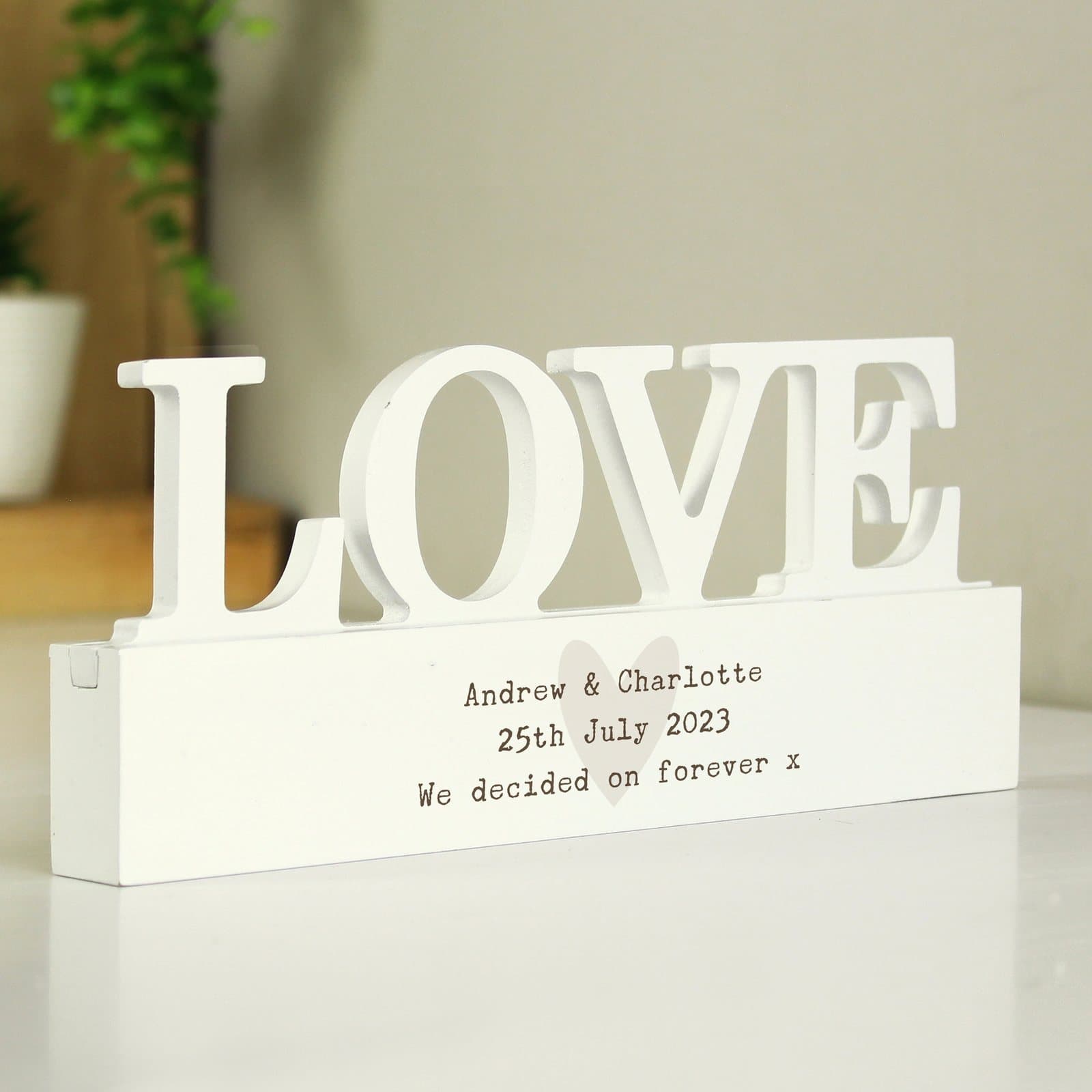 Handmade wooden love ornament with three lines of personalised text