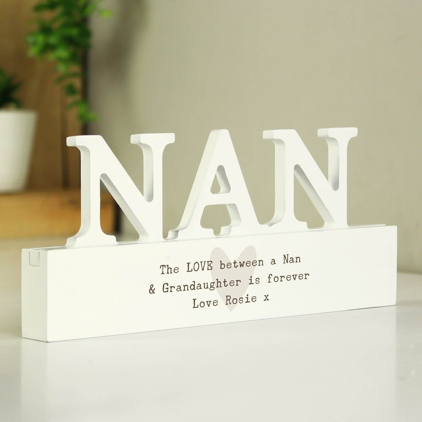 Handmade wooden nan ornament with three lines of personalised text
