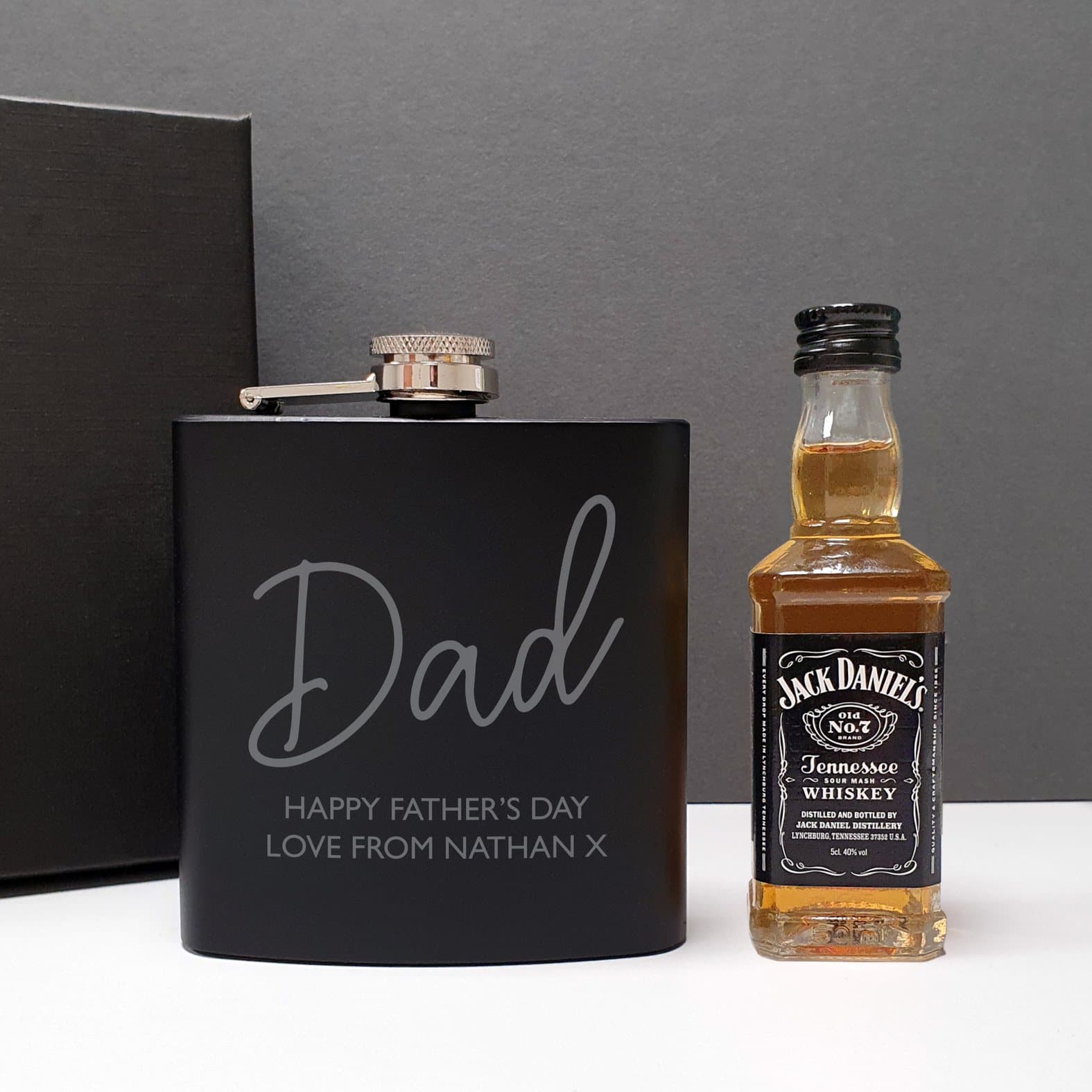 Black personalised hip flask with a whisky miniature and black gift box