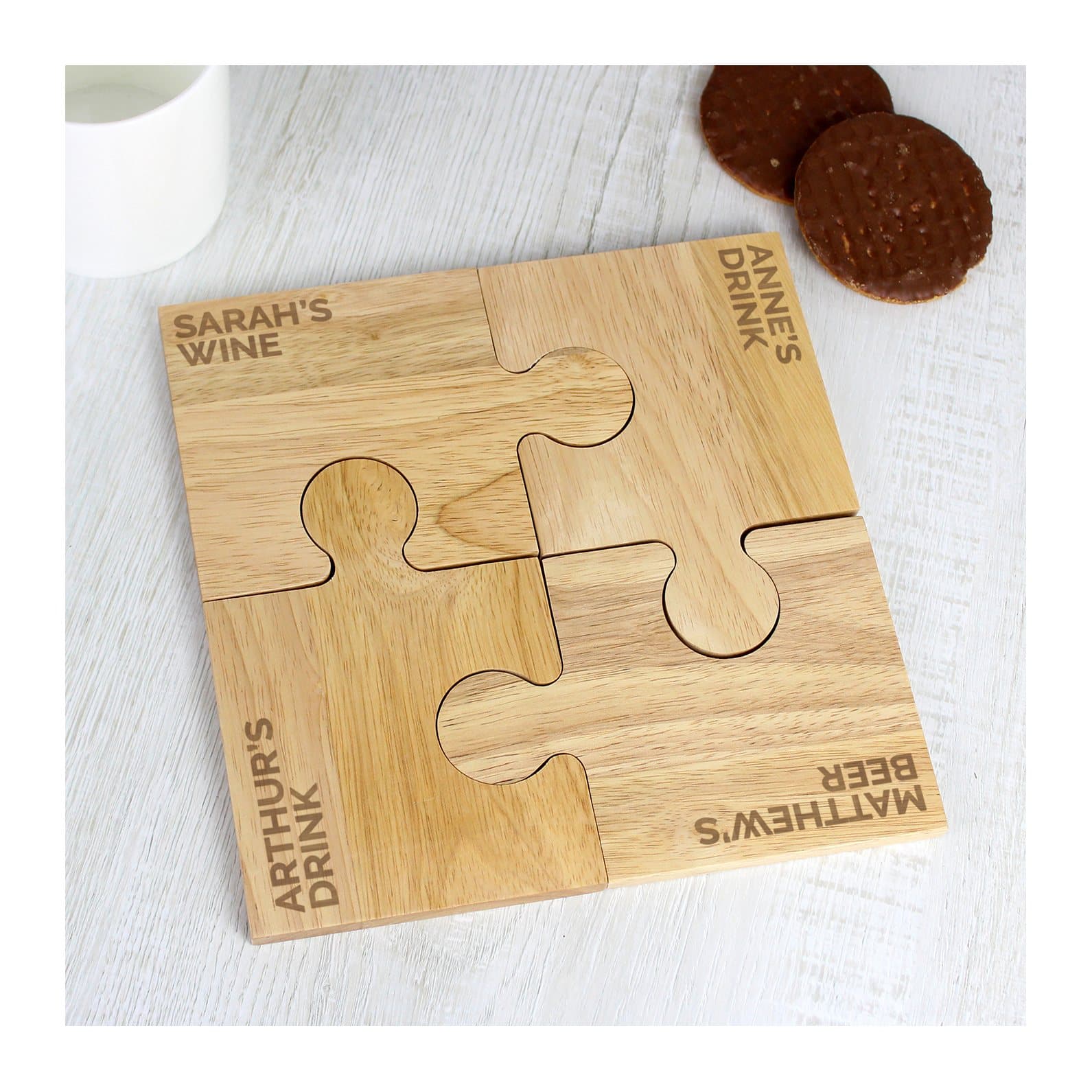 Set of four personalised wooden jigsaw shaped coasters