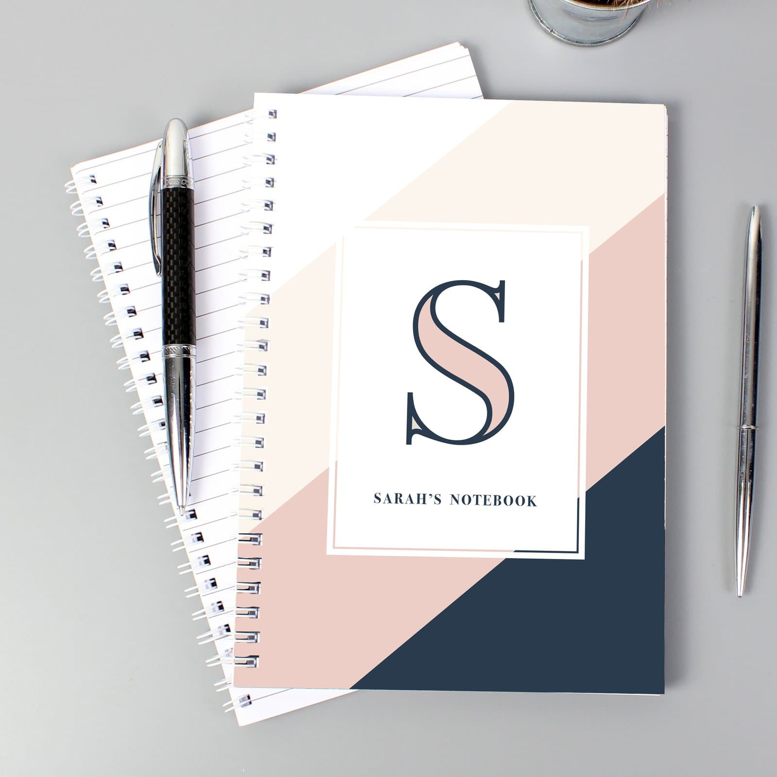 Navy and blush A5 notebook with a name and first initial on the cover