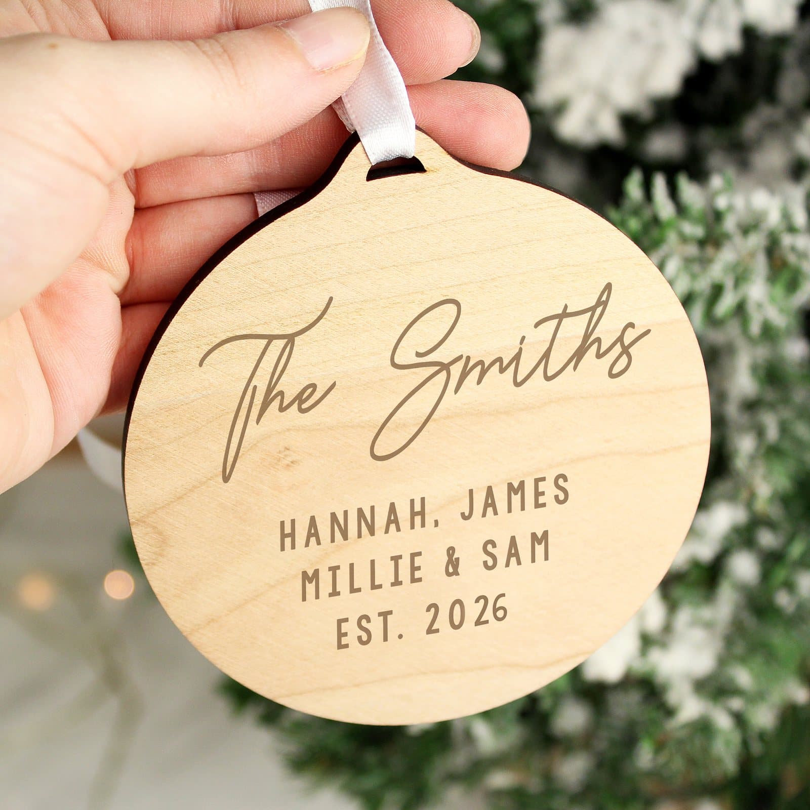 Personalised round wooden decoration with ribbon