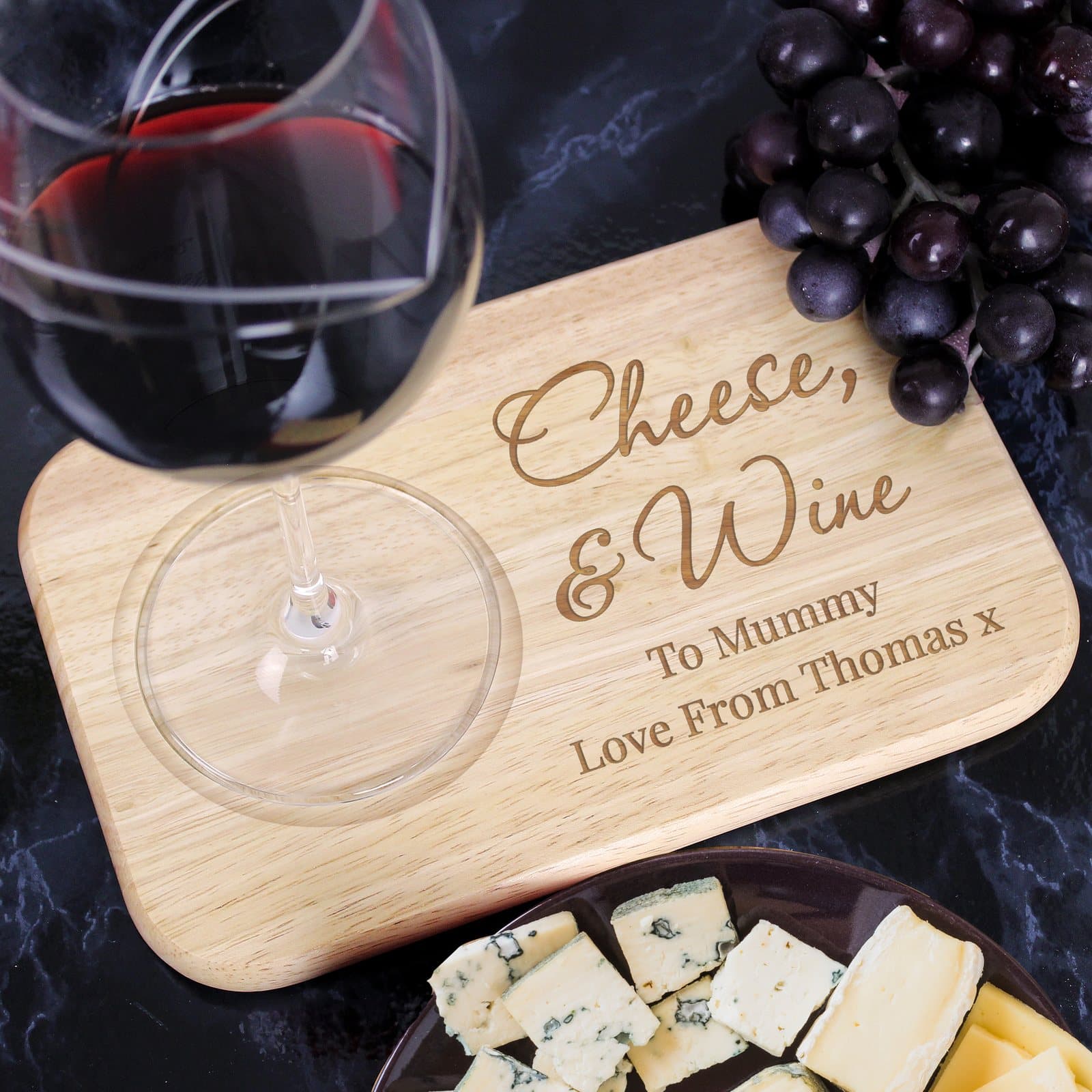 Wooden coaster tray with script and text lines and a circular drink groove