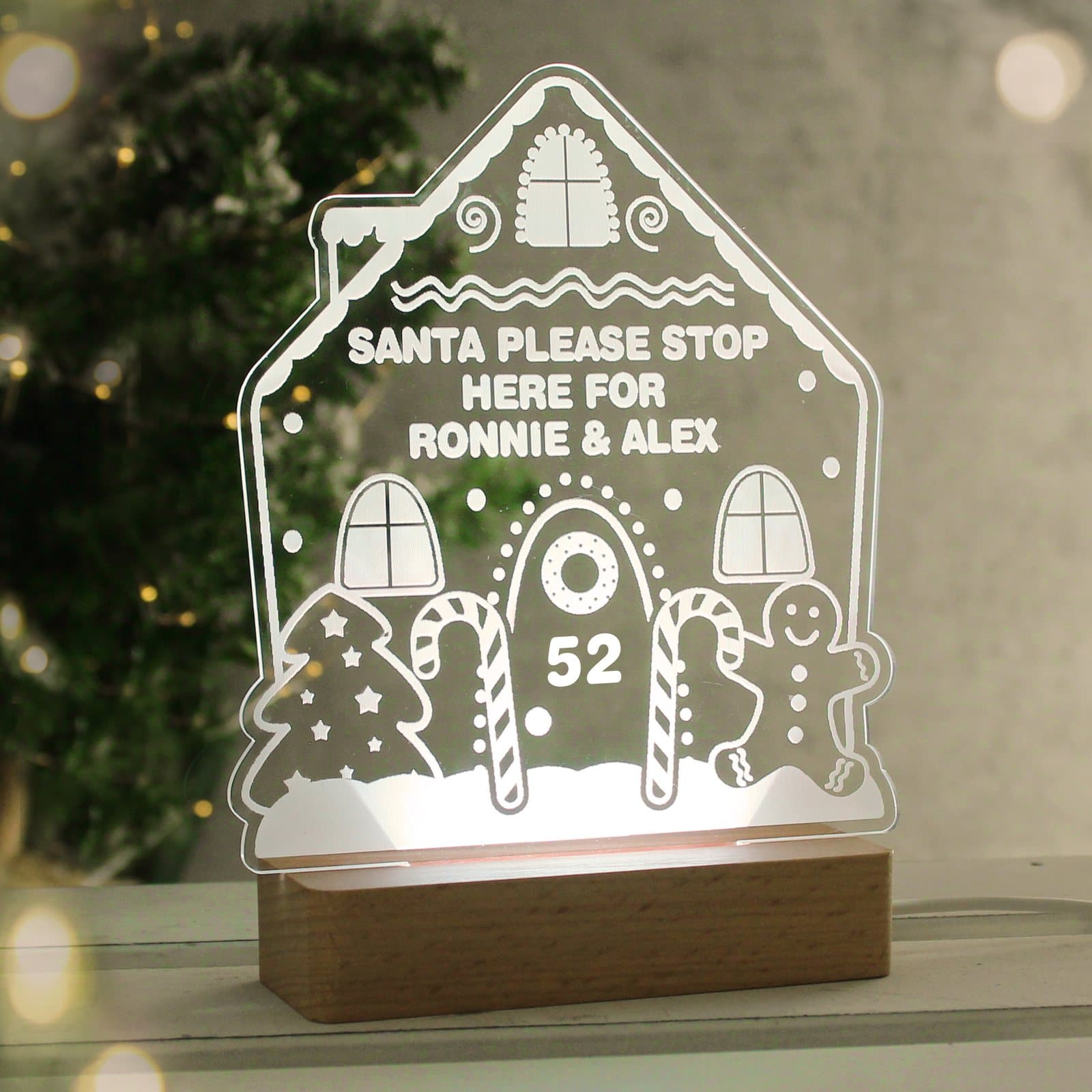 Gingerbread house sign LED light on a wooden base