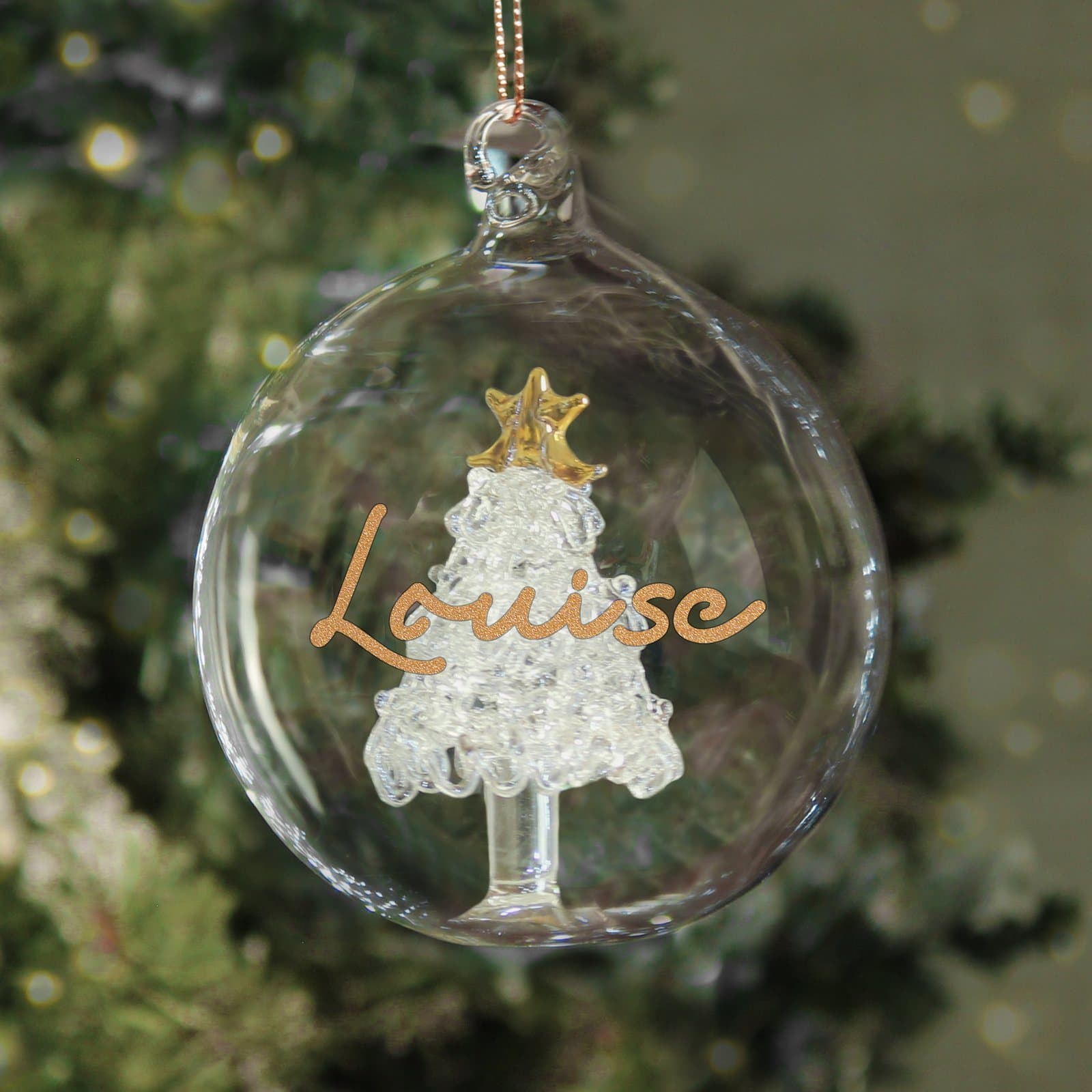 Gold glitter glass bauble with a tree design