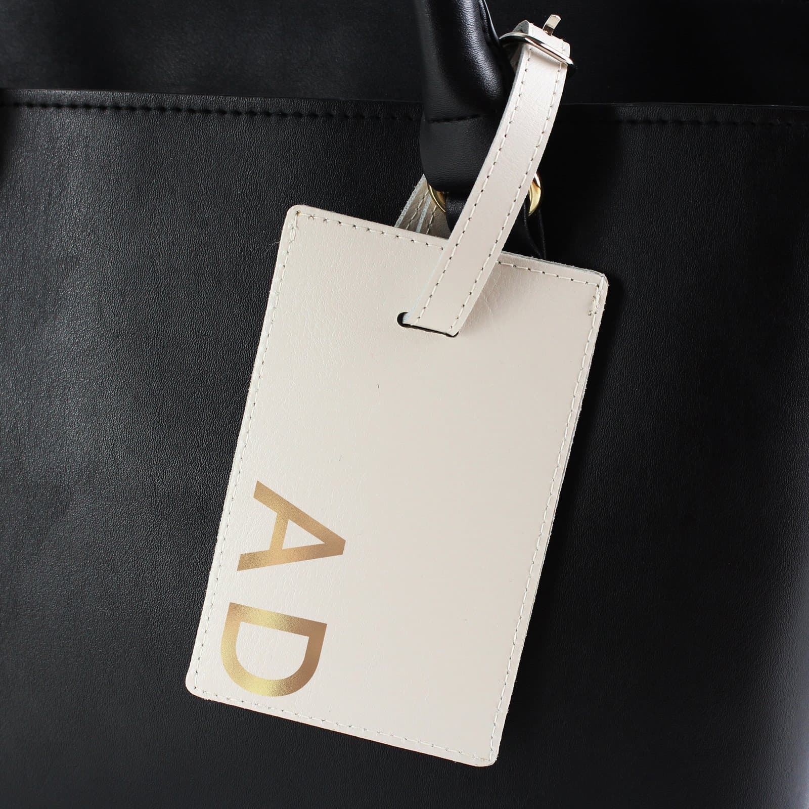 Leather luggage tag with gold initials in cream or black
