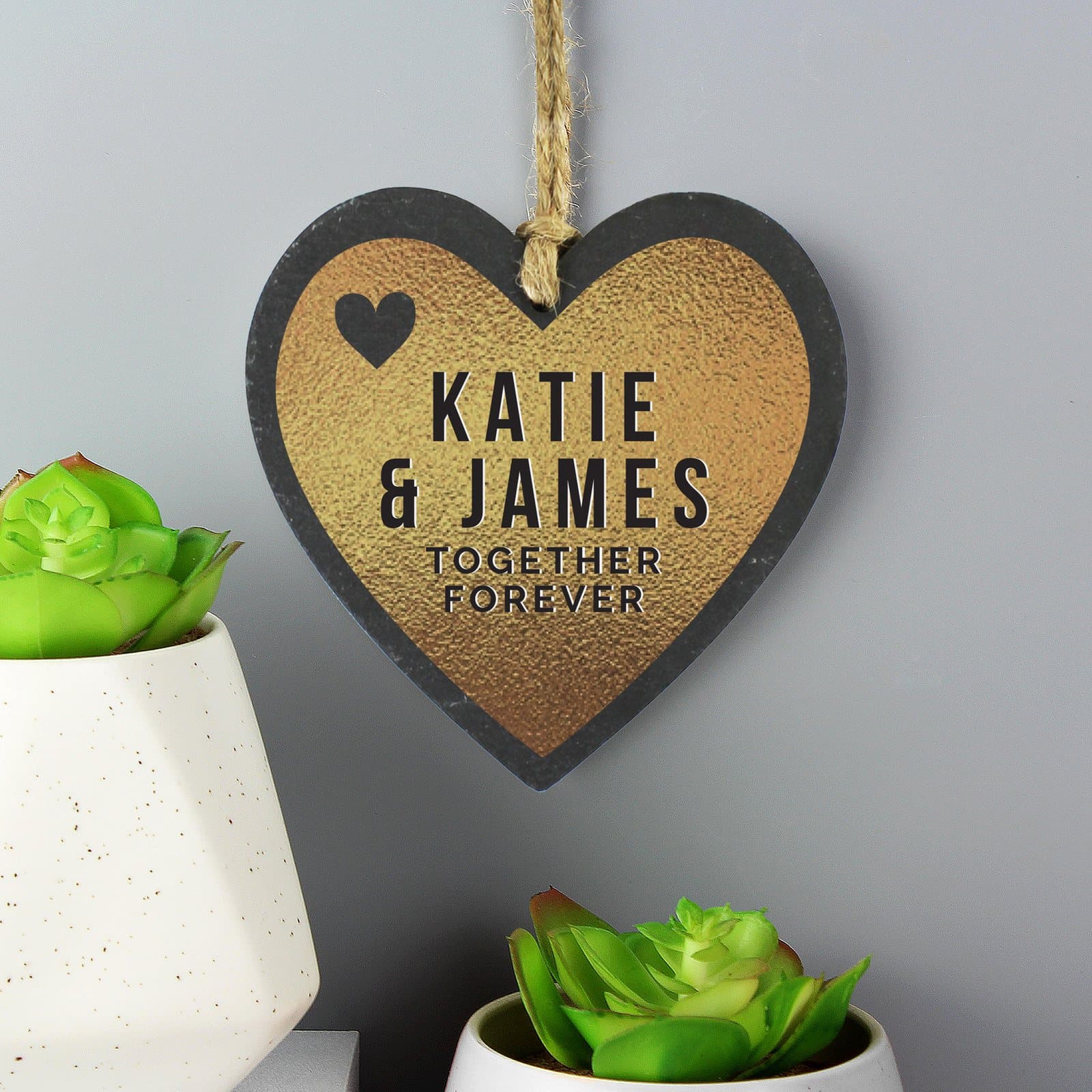 Gold heart printed on a slate heart decoration with natural string