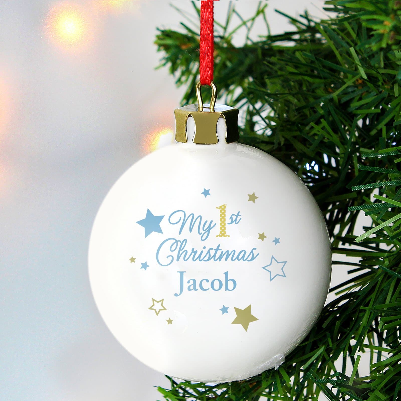 Ceramic My 1st Christmas bauble with gold stars and a ribbon