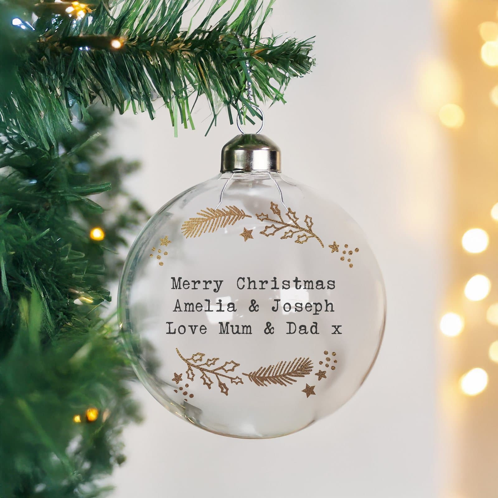 Glass Christmas bauble with a gold wreath design