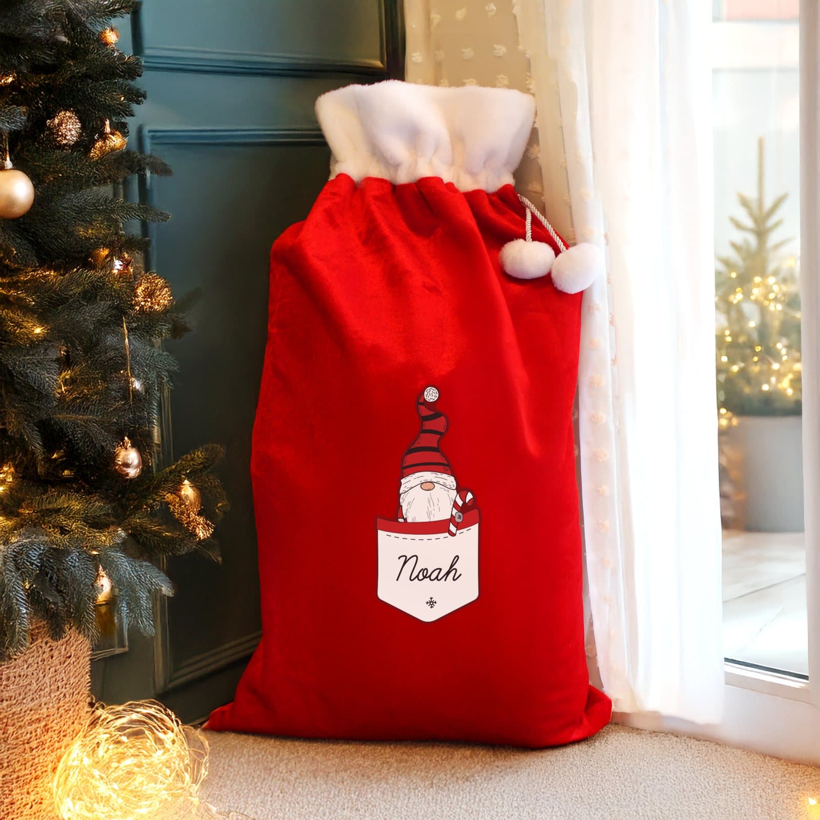 Red fleece Christmas sack with a male Gonk character