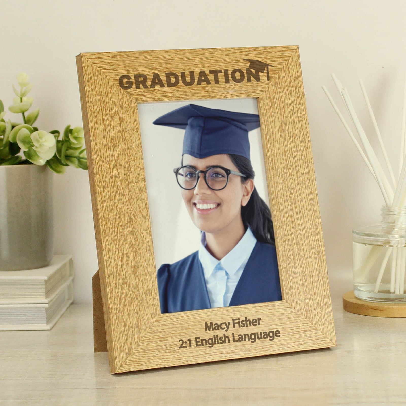Oak finish wooden graduation photo frame with a message below the photo
