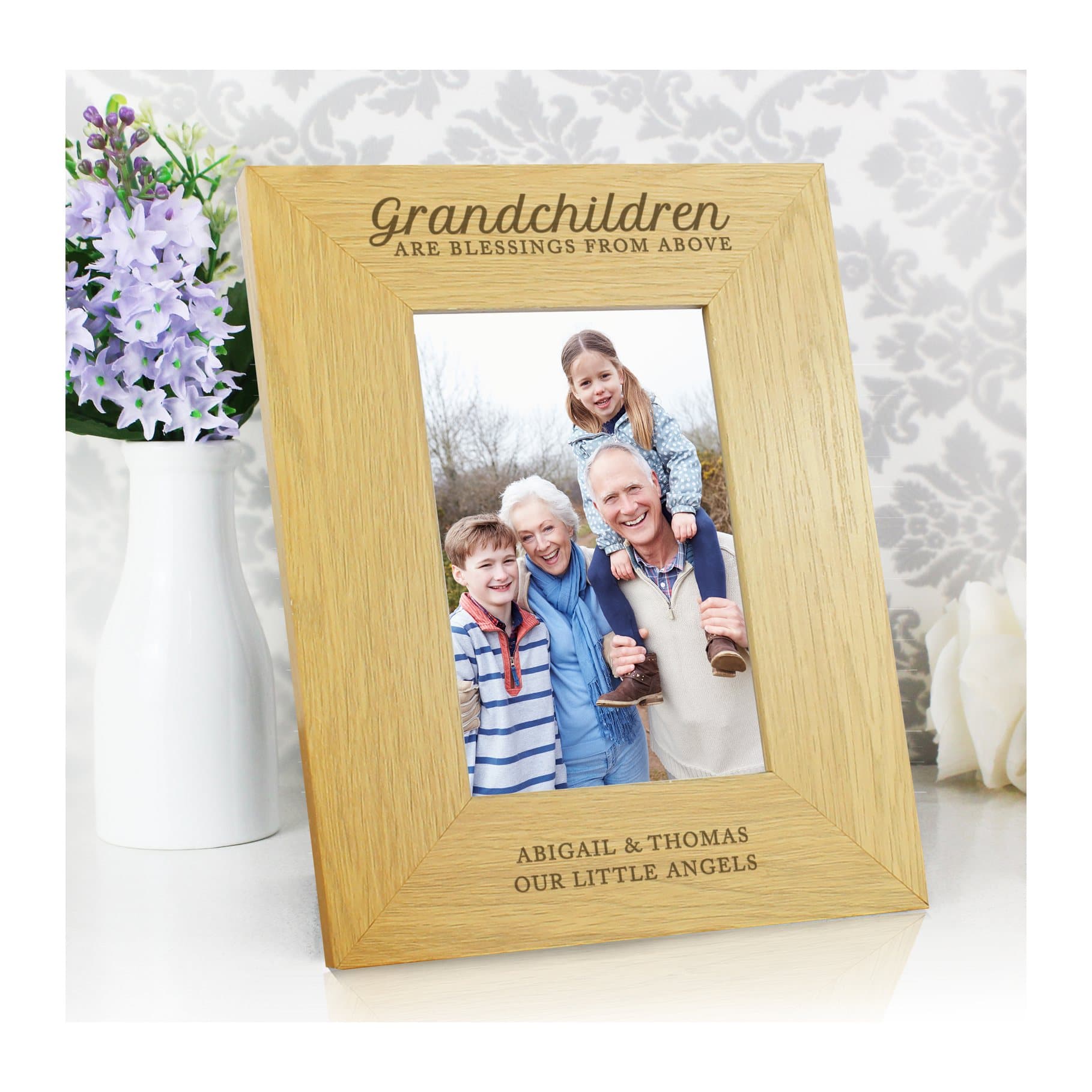 Oak finish wooden grandchildren photo frame with text below the portrait photo