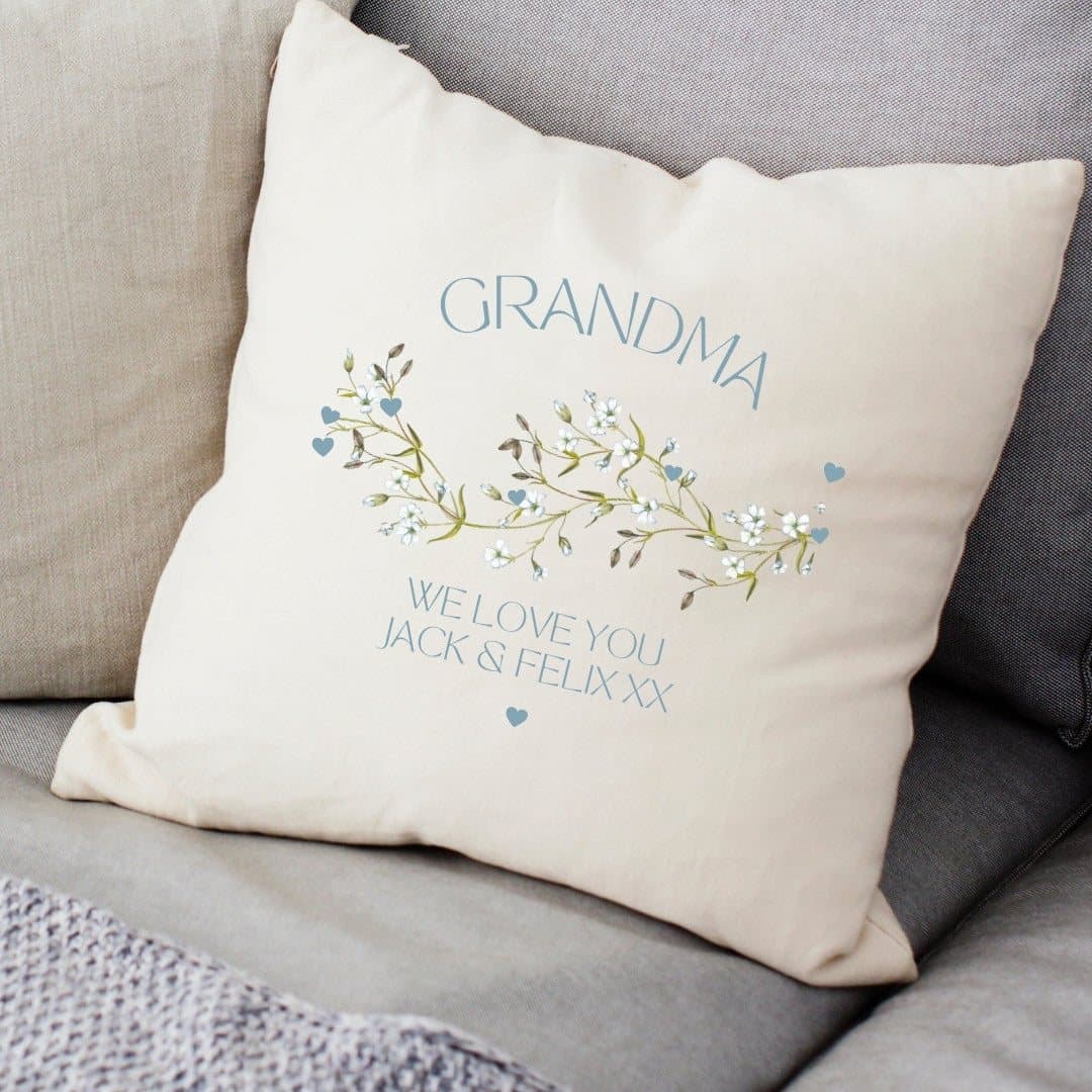Cream linen-look cushion with a blue floral pattern and personalised wording