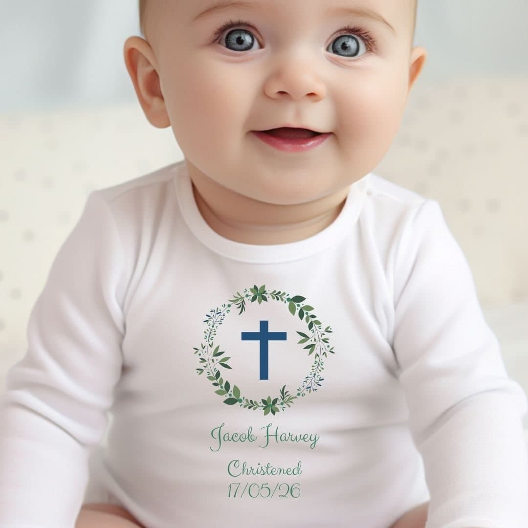 Green christening baby outfit with foliage artwork and a personalised name