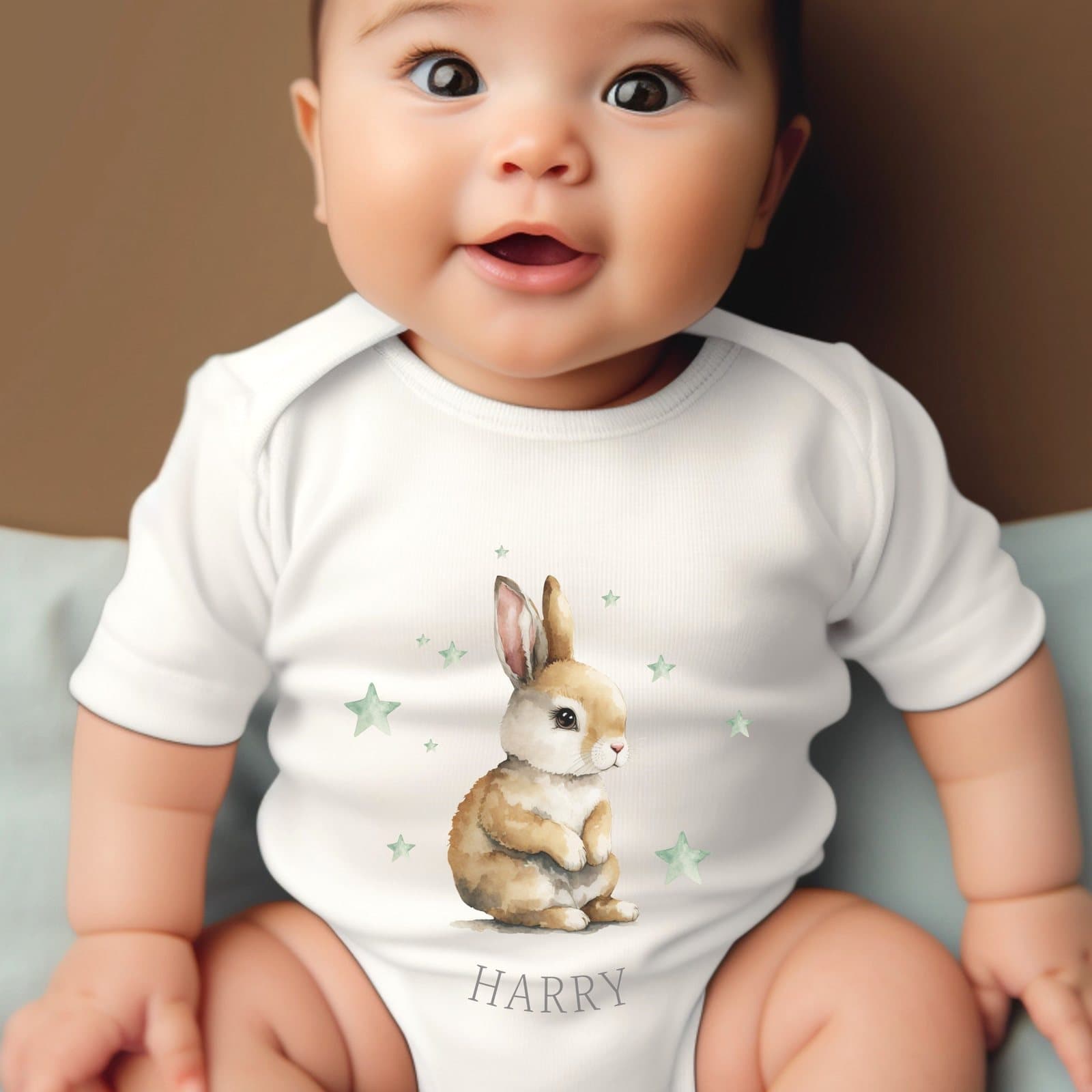 Personalised green stars and bunny baby grow with a name printed on it