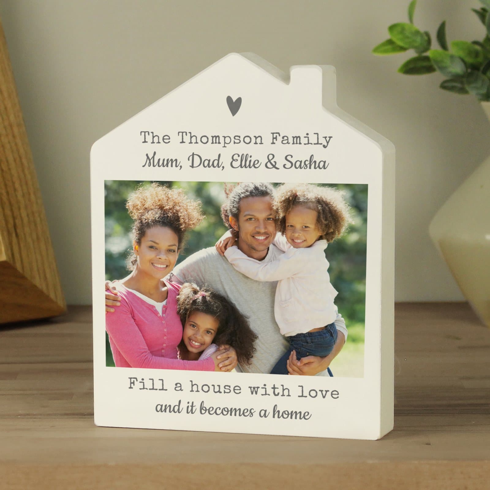 Wooden house ornament with a grey heart design and photo