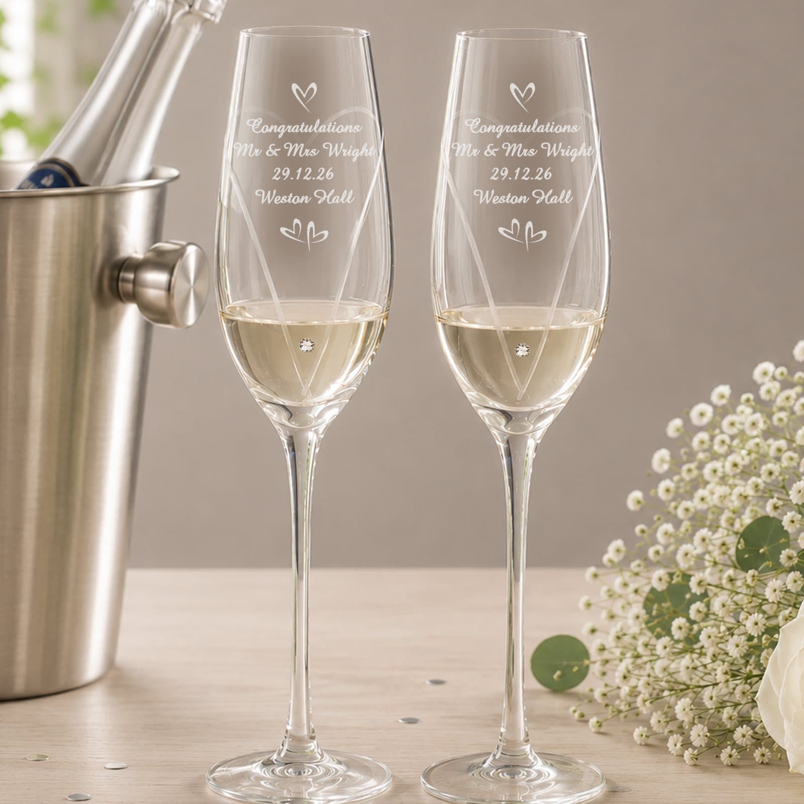 Pair of diamond effect flutes with a cut heart swirl and small hearts