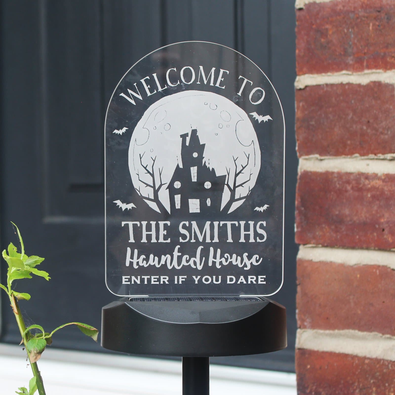 Haunted House Halloween solar light sign with Welcome to text and a personalised name