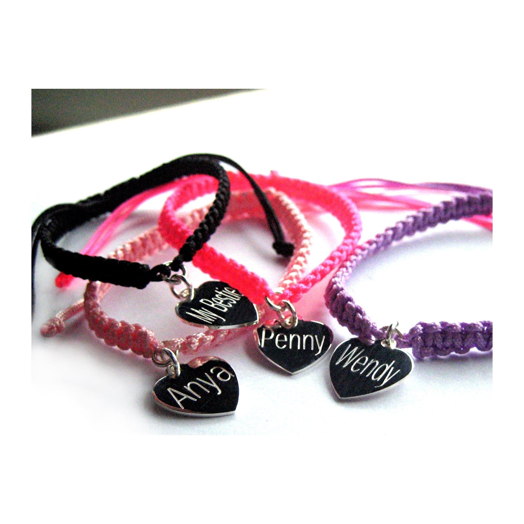 Braided nylon friendship bracelet with a silver heart charm