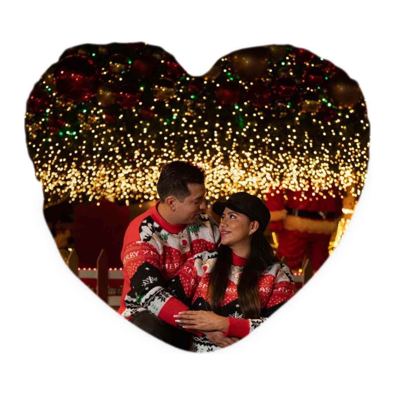 Heart-shaped cushion printed with a couple under Christmas lights