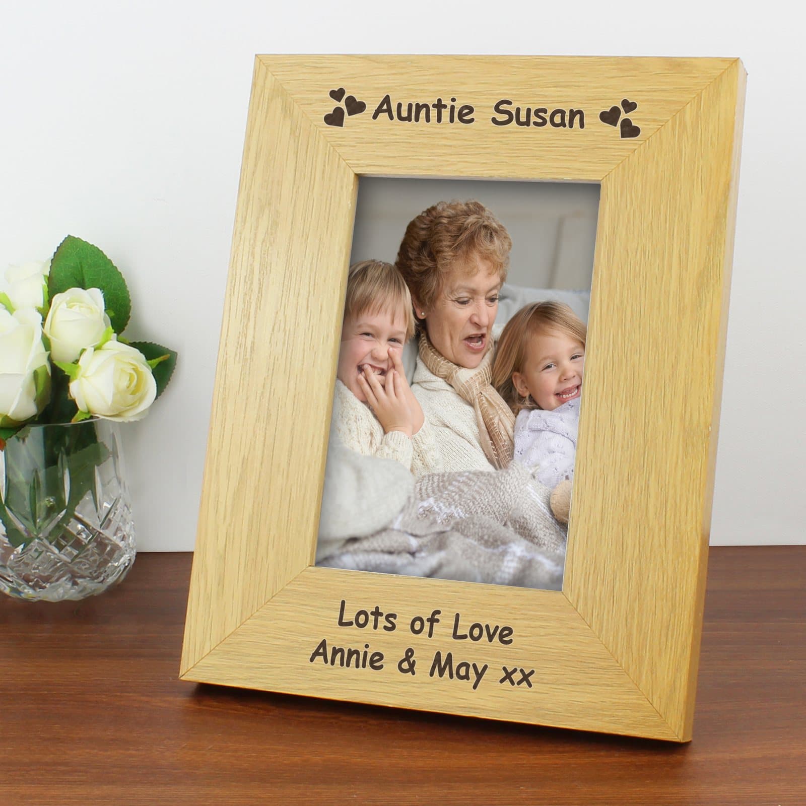 Oak finish hearts photo frame with text above and below a portrait photo