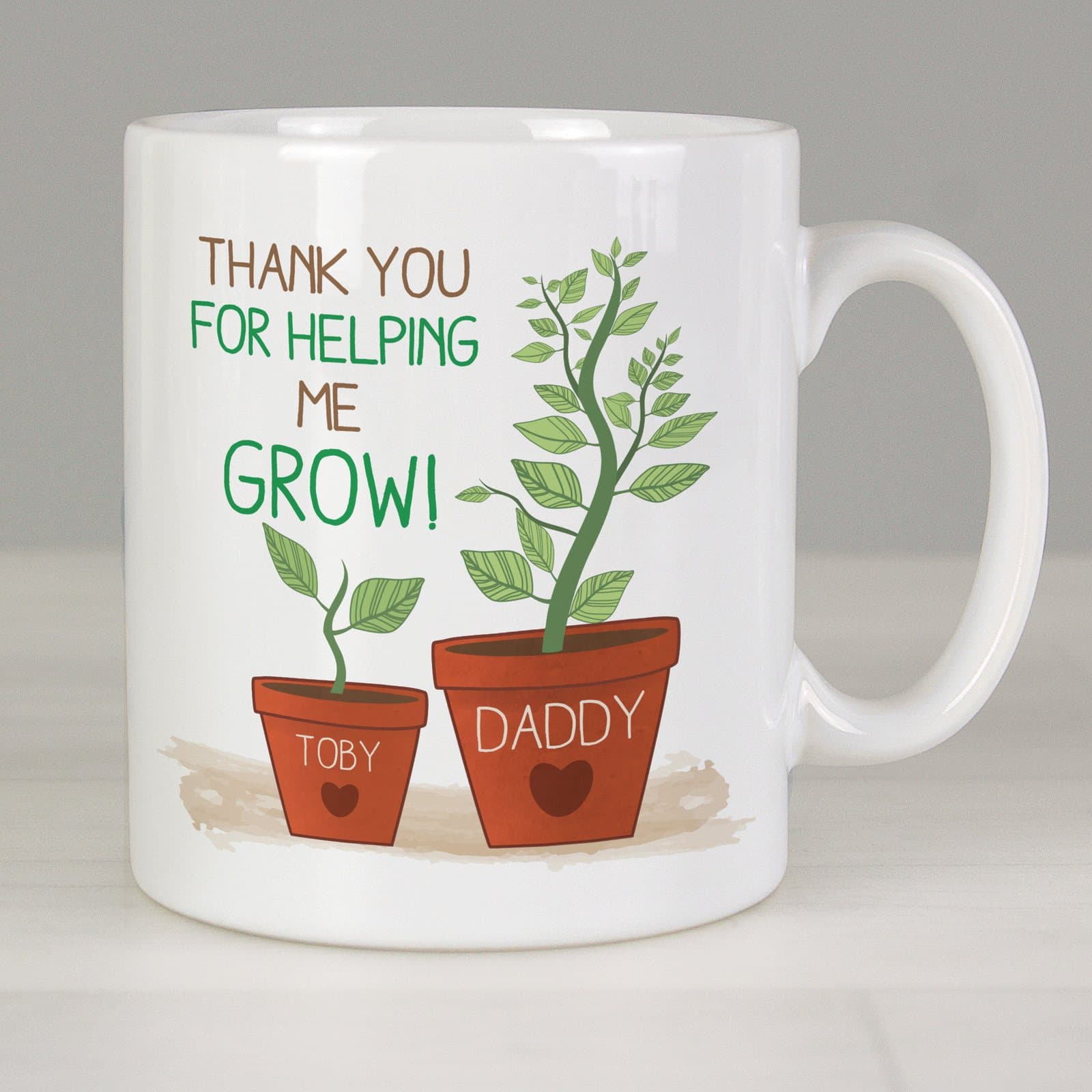 Personalised ceramic mug with a large plant and a small plant carrying two names
