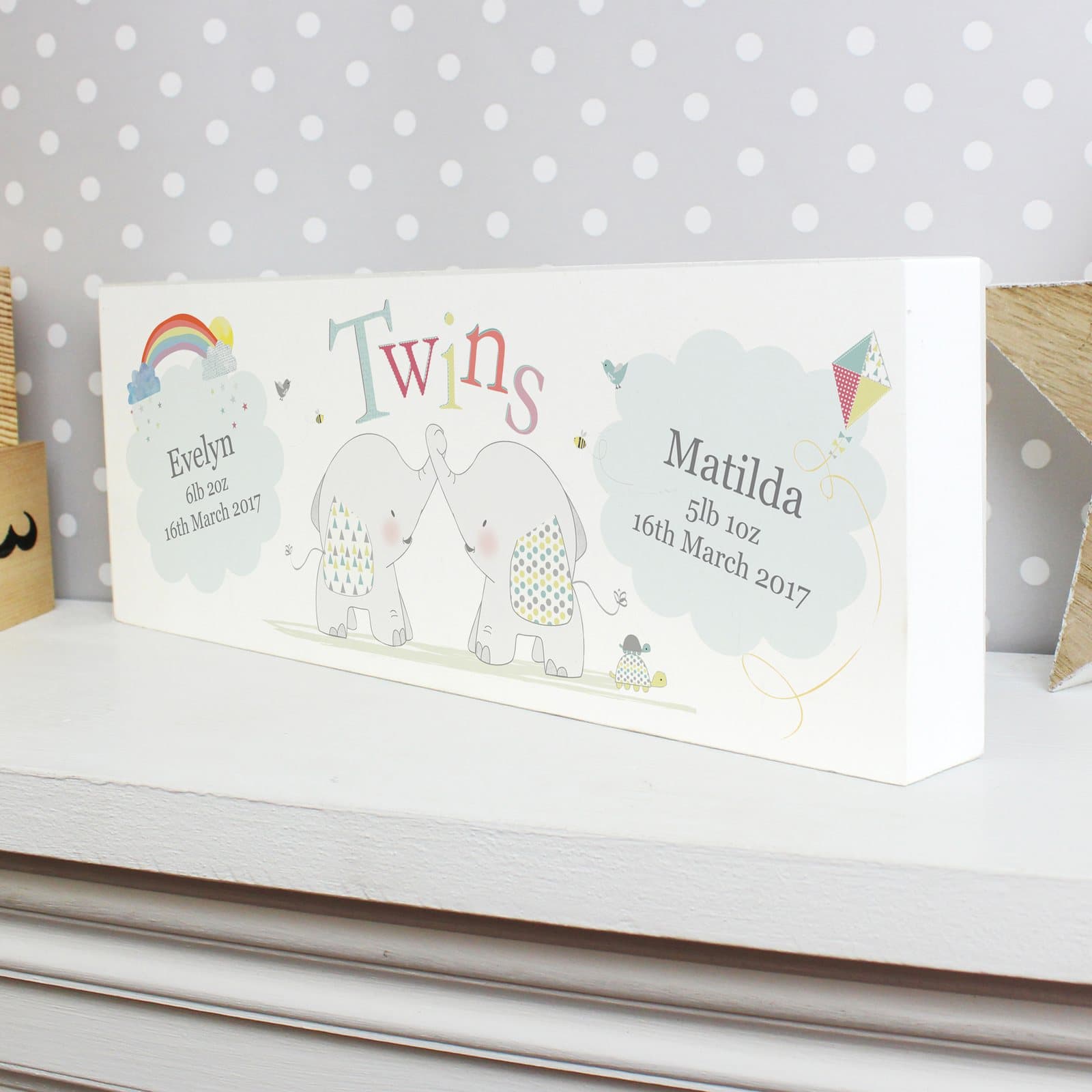 Wooden mantel block with a hessian elephant twins design and two names