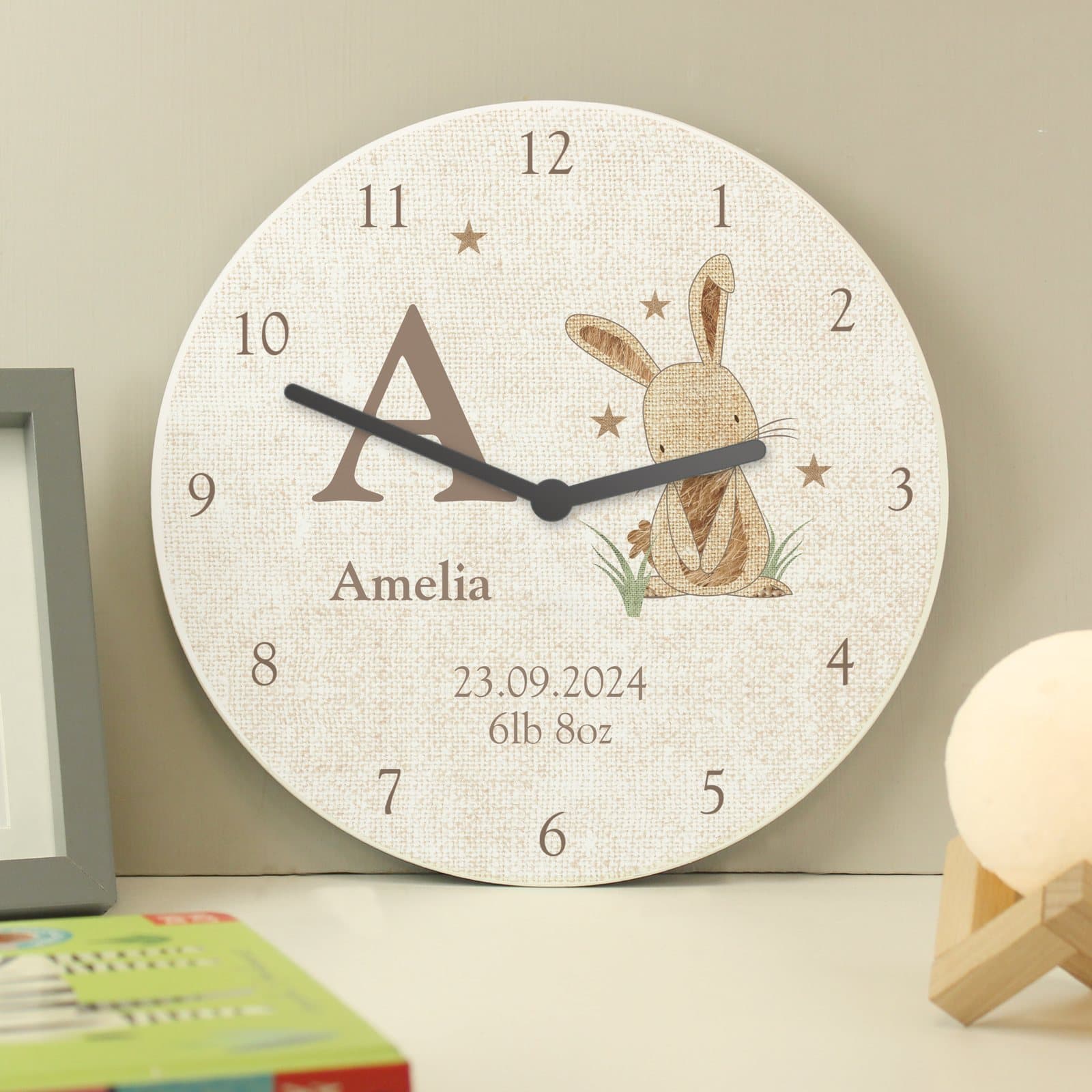 Wooden clock with a hessian bunny character, personalised with a name