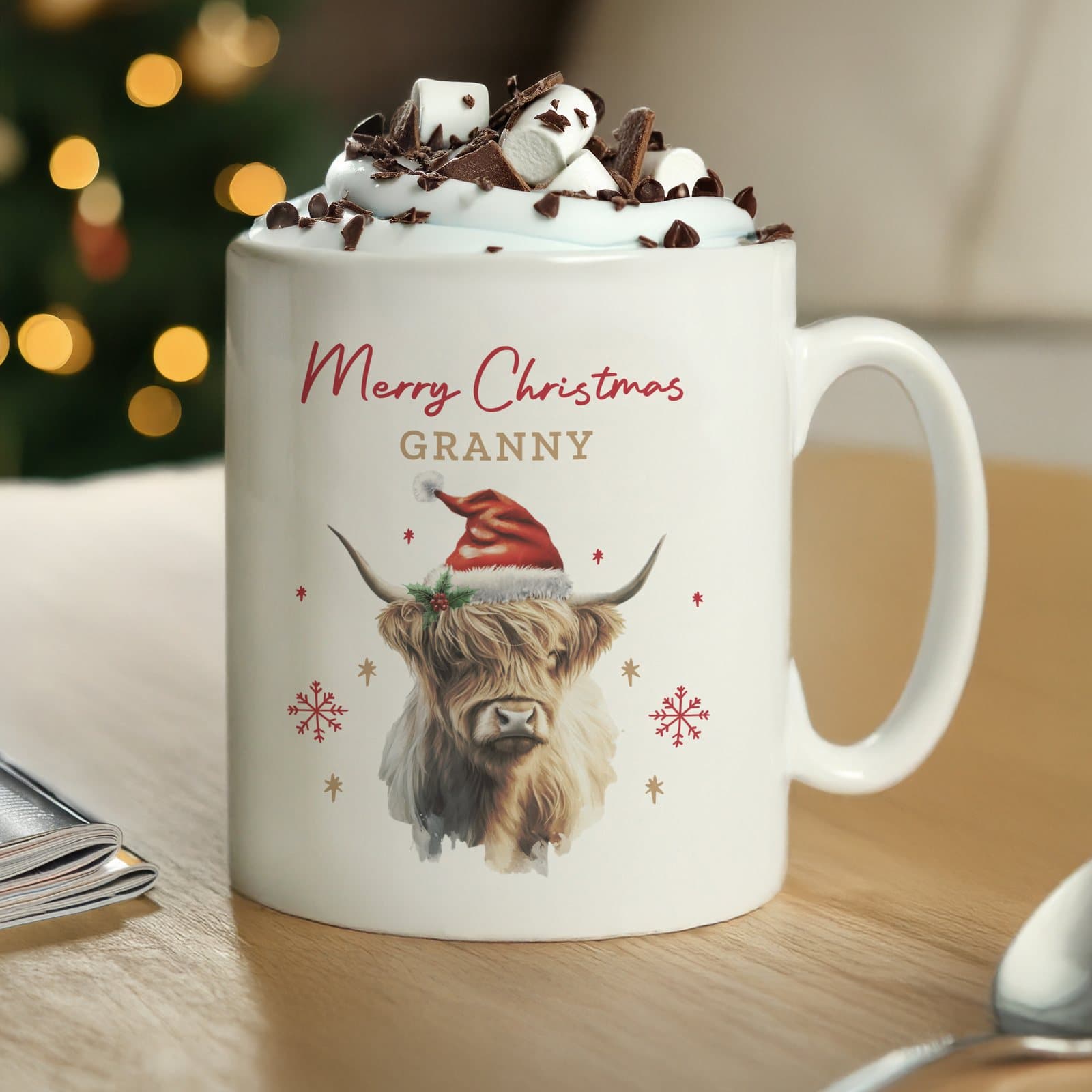 Highland cow Christmas mug dressed for the season, personalised with text