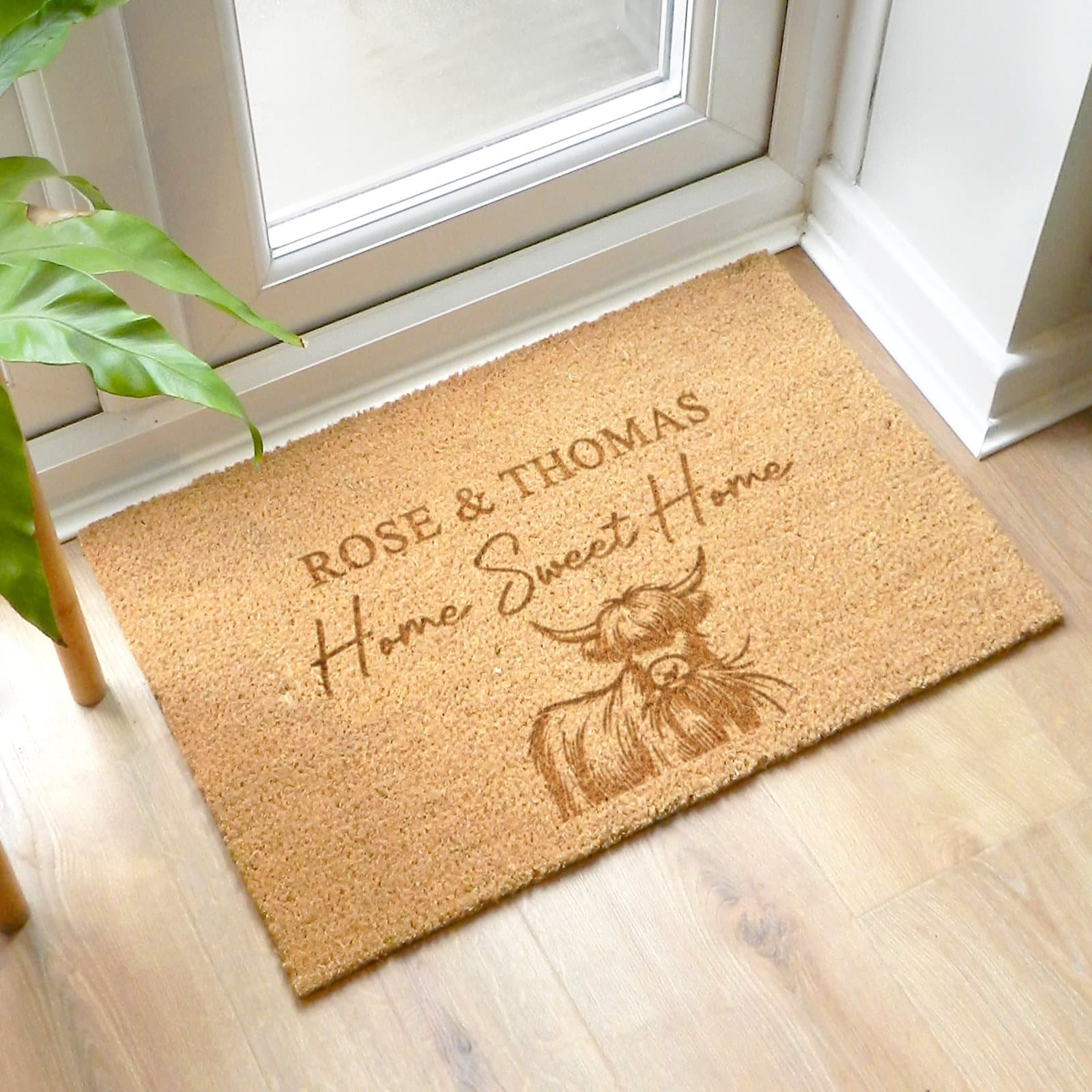 Rectangular coir Highland cow doormat with Home Sweet Home text