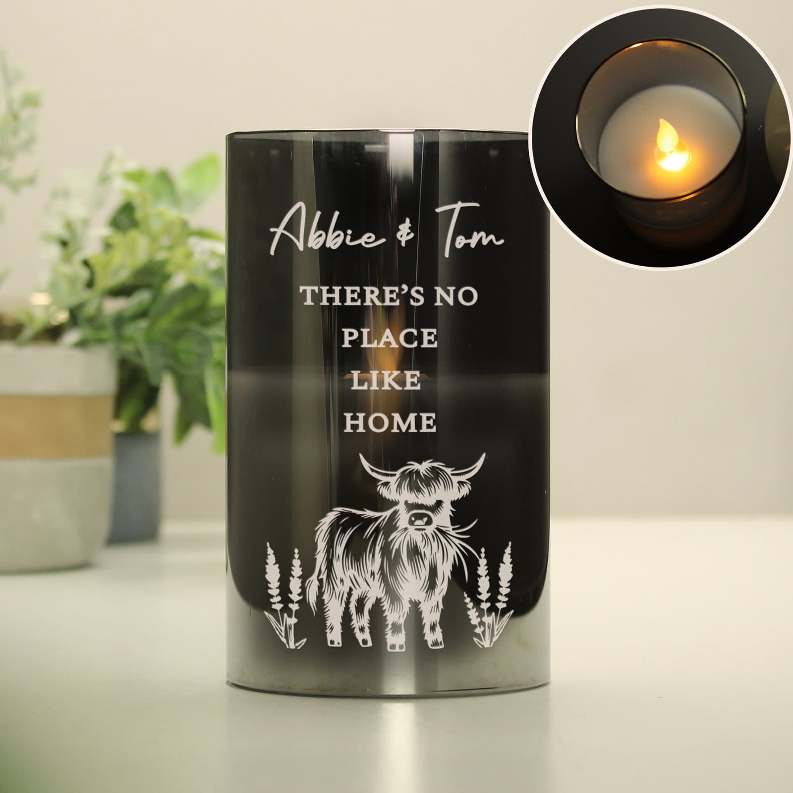Frosted glass LED candle with a Highland cow design and personalised lines
