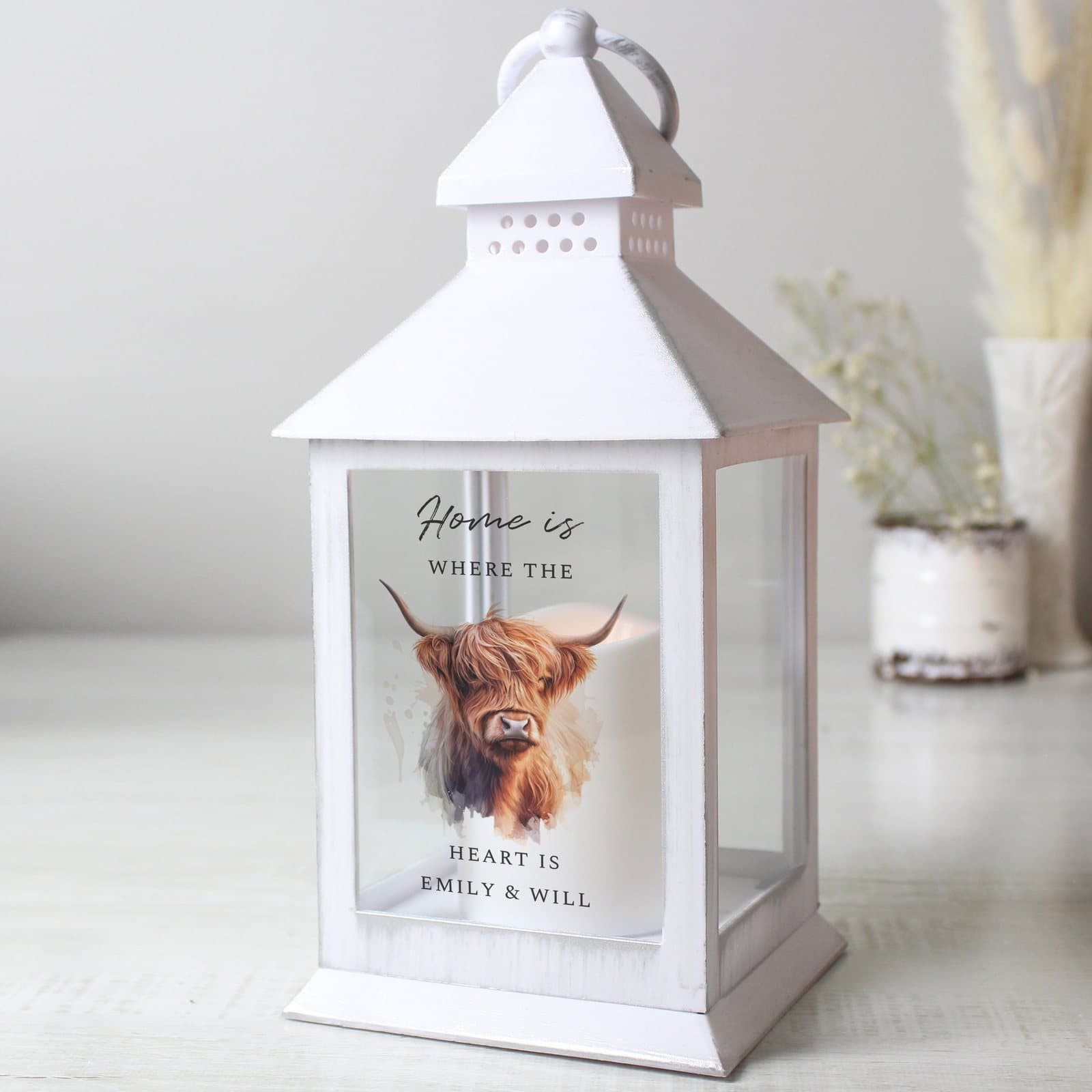 Highland cow LED lantern with a flickering flame effect and personalised text